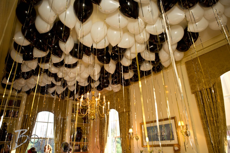A surprise in every room! Black and white balloons with silver streamers fill the third floor Codman room to create a magical shimmery effect for guests.