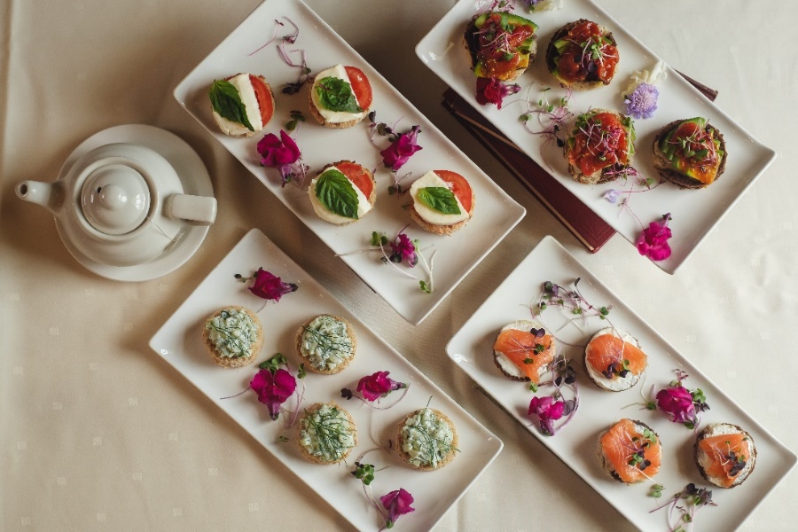 A selection of tea sandwiches from our Afternoon Tea selections:  smoked salmon and creme fraiche, cucumber and dill, heirloom tomato and buffalo mozzarella with fresh basil, and avocado with confit cherry tomato.