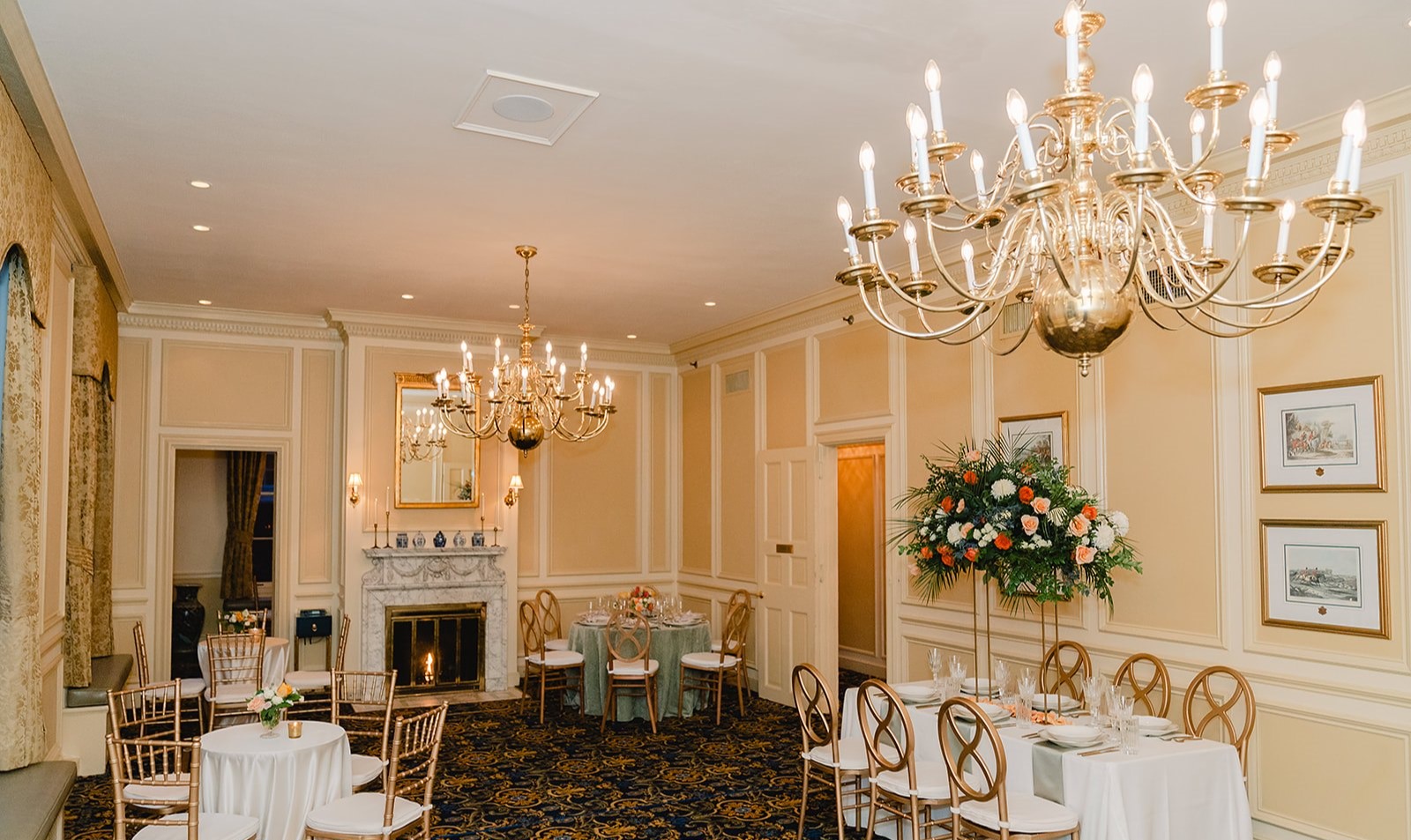 a room filled with furniture and vase of flowers on a table