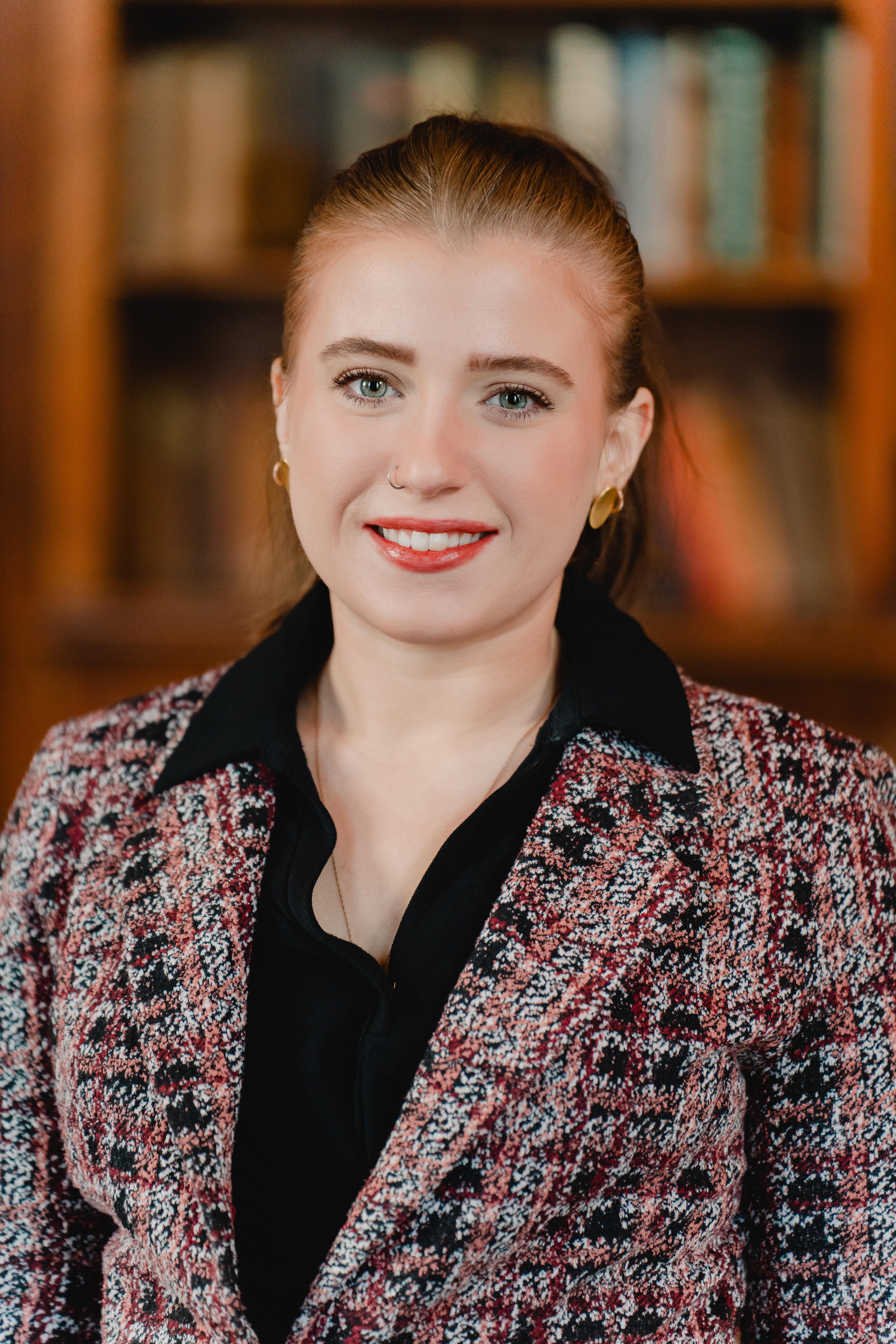 a person who is smiling and looking at the camera