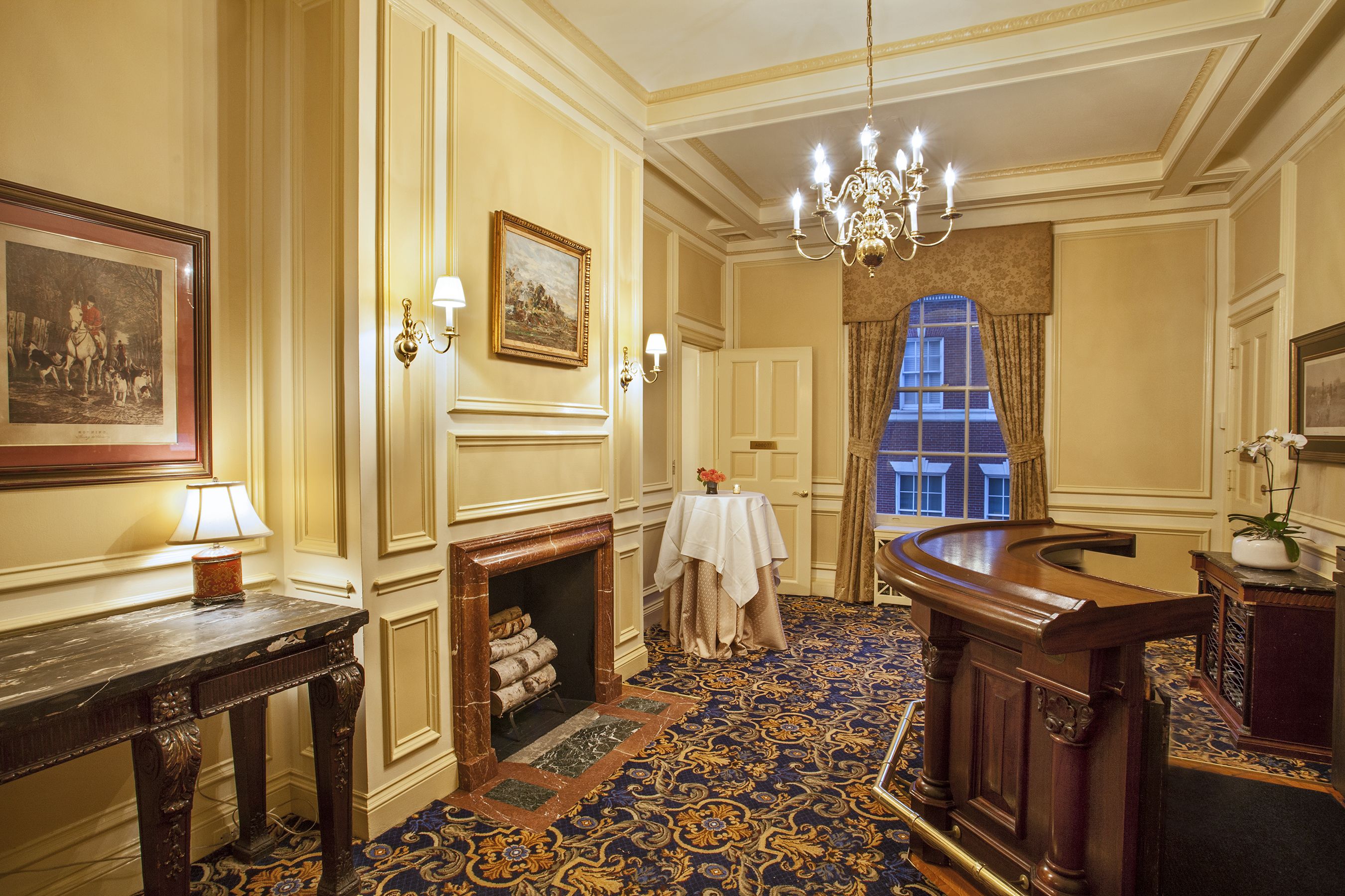 a room with a fireplace and a bar