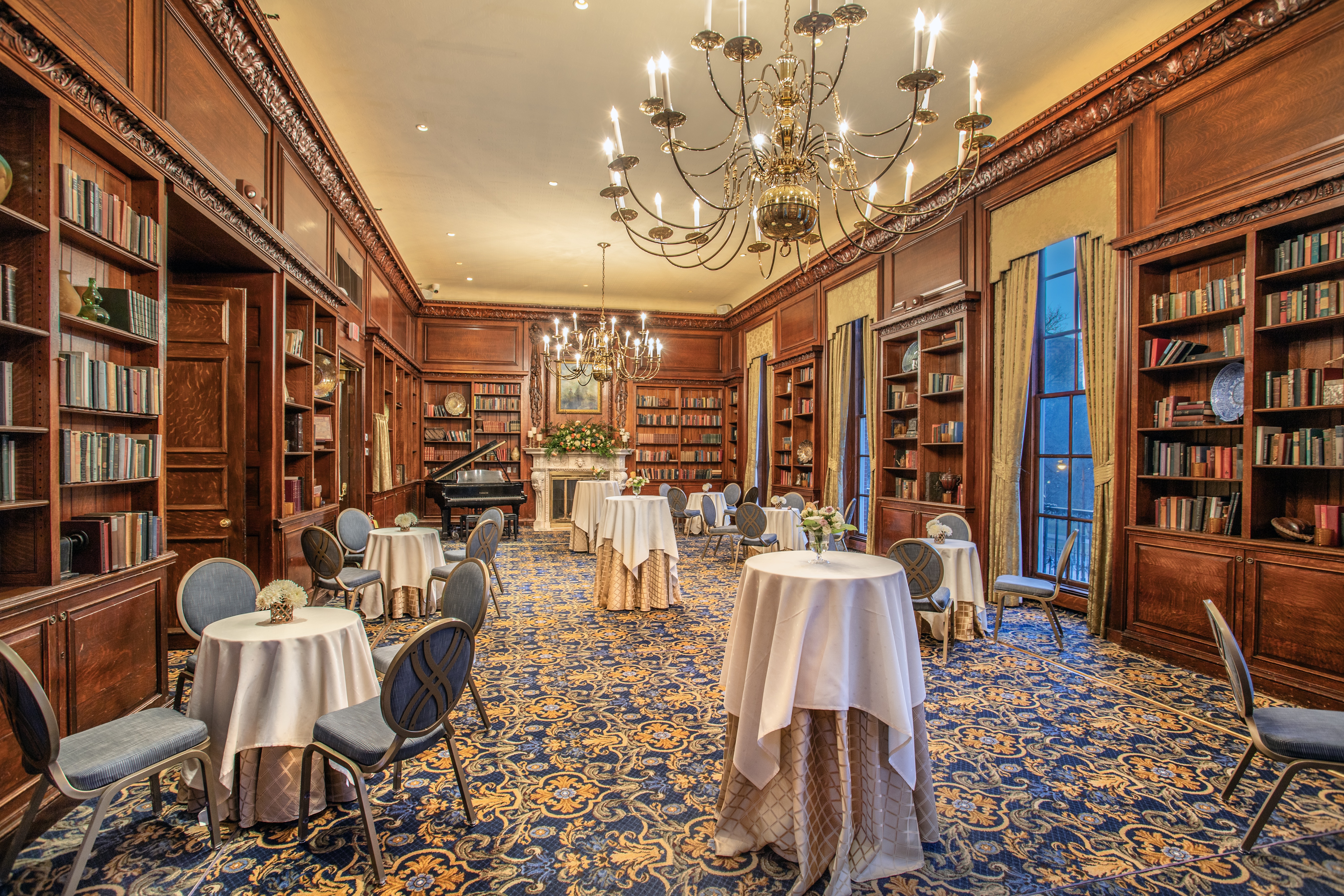a living room filled with furniture and a book shelf
