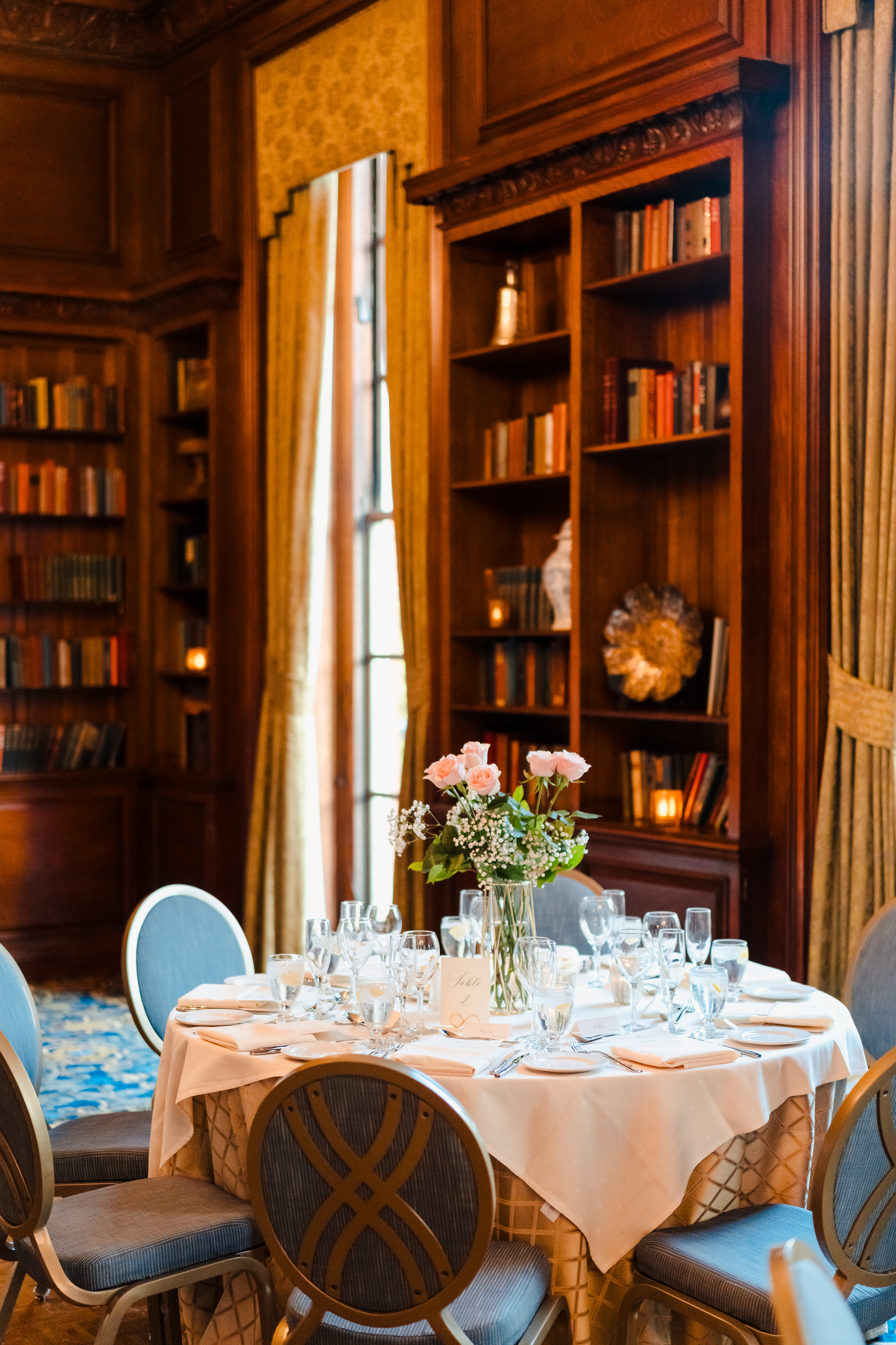 a room filled with furniture and vase on a table