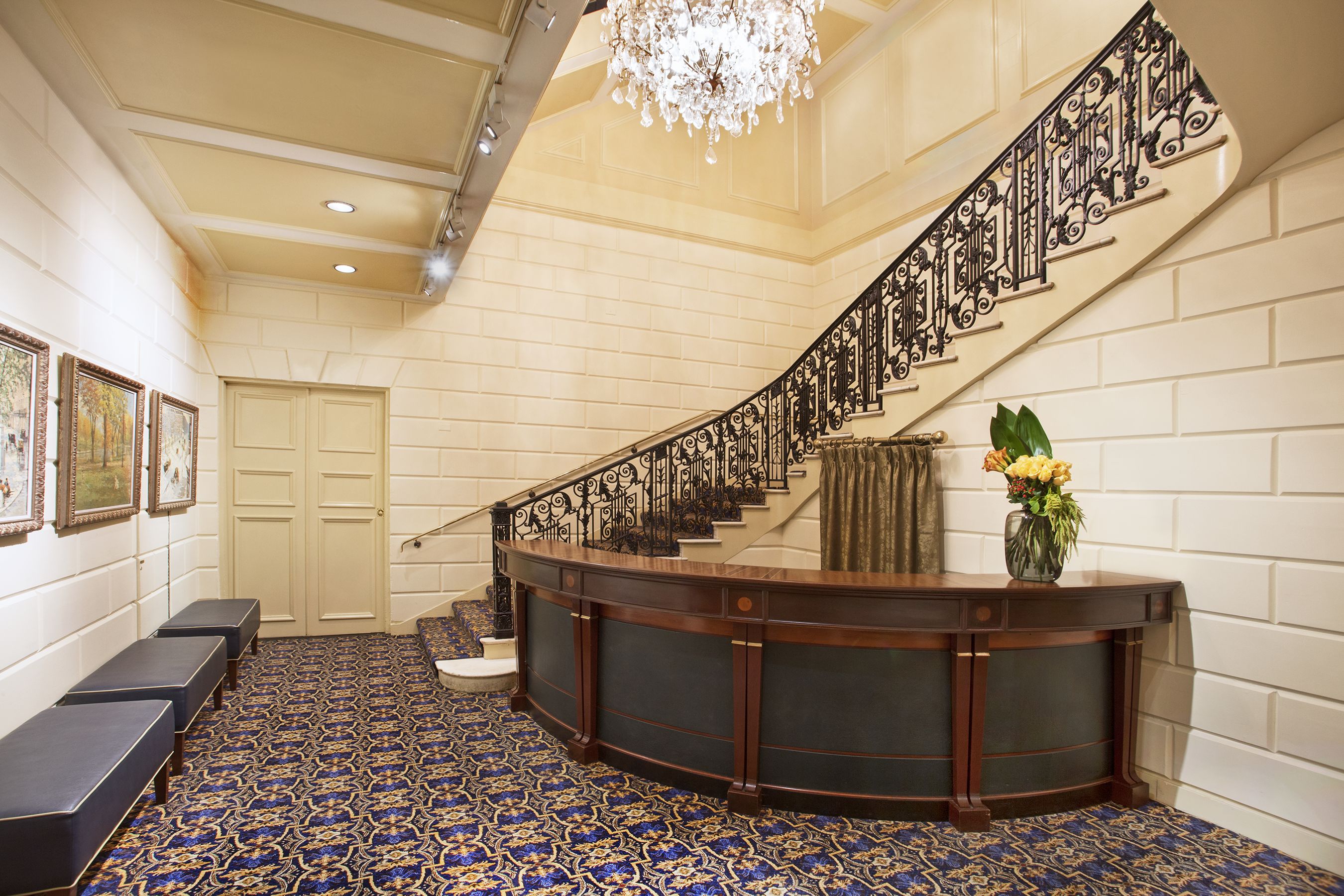 the lobby of a building with a staircase