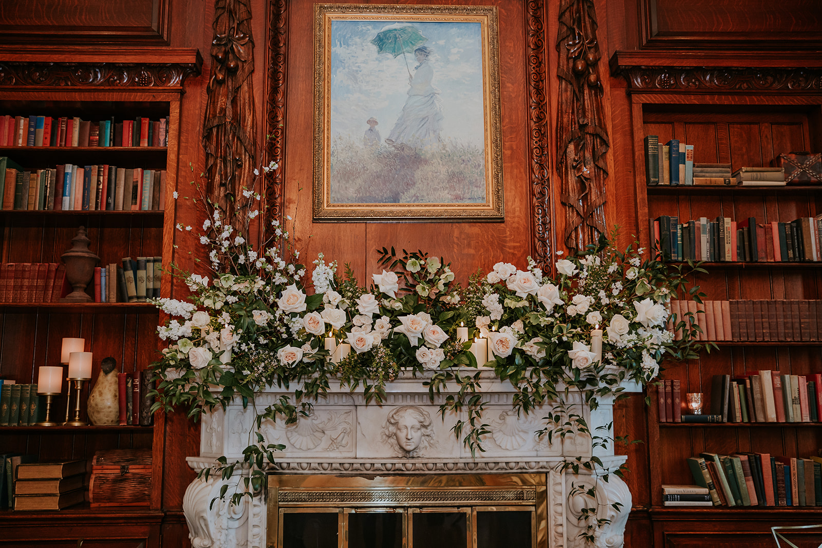 a fire place sitting in a living room with a book shelf
