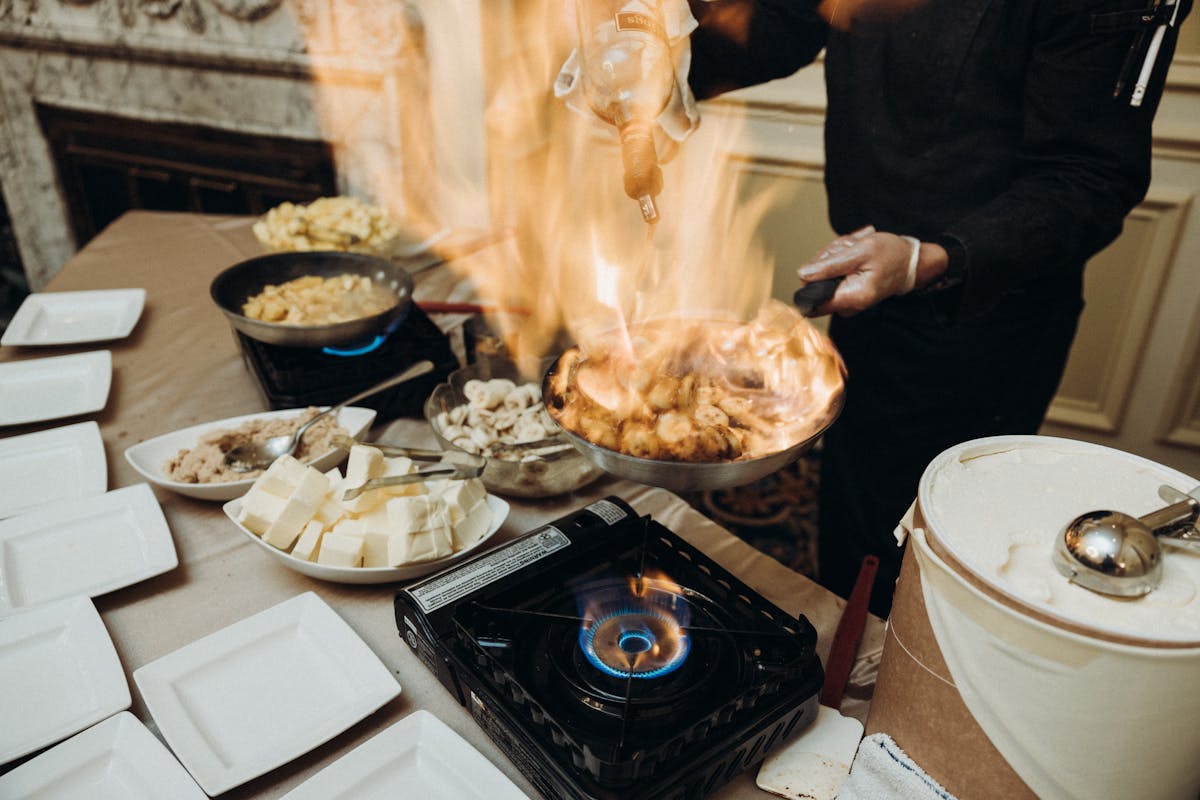 a person cooking food in a bowl