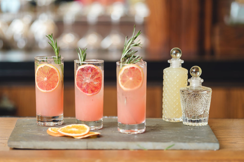 a glass of orange juice on a table
