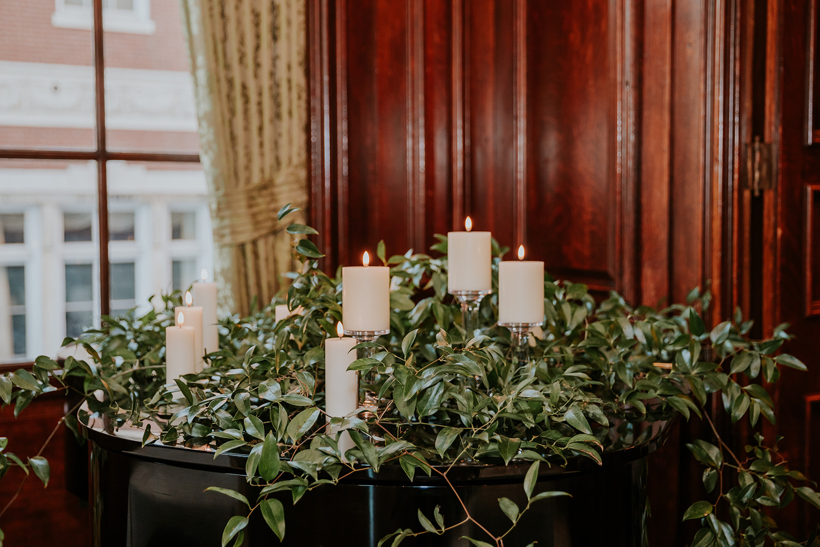 a vase of flowers sits in front of a window