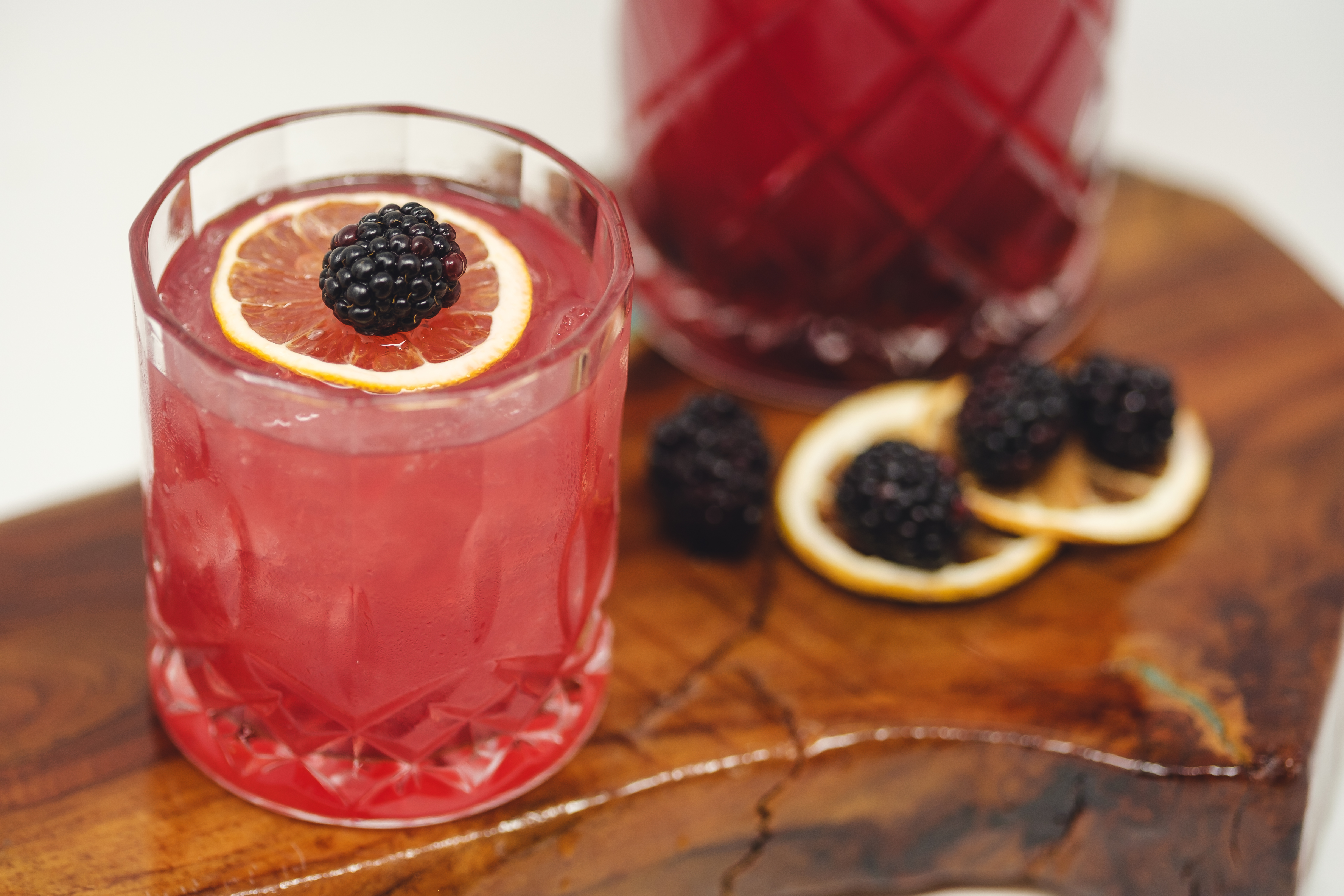 a glass of orange juice next to a cup of coffee