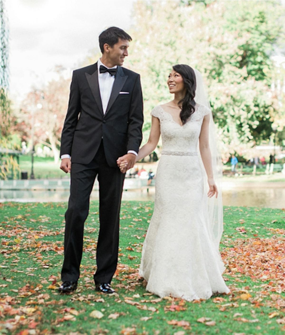 a woman standing next to a man in a suit and tie