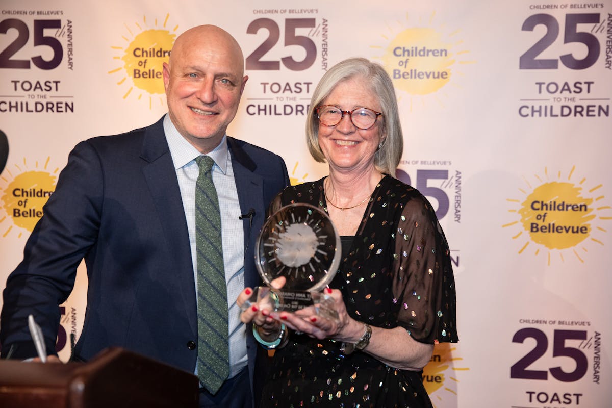 a man and a woman with a prize