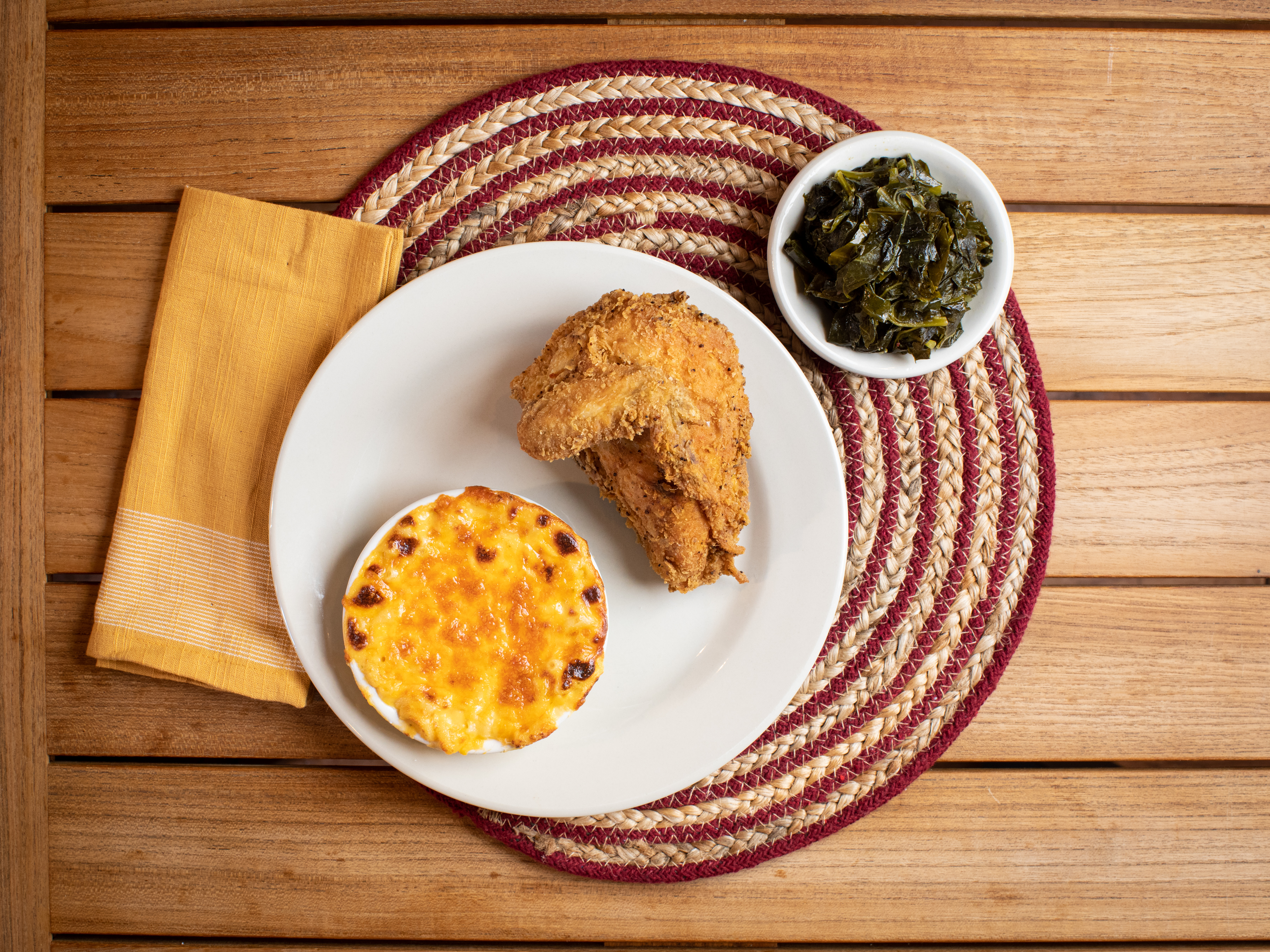 a plate of food sitting on top of a wooden table