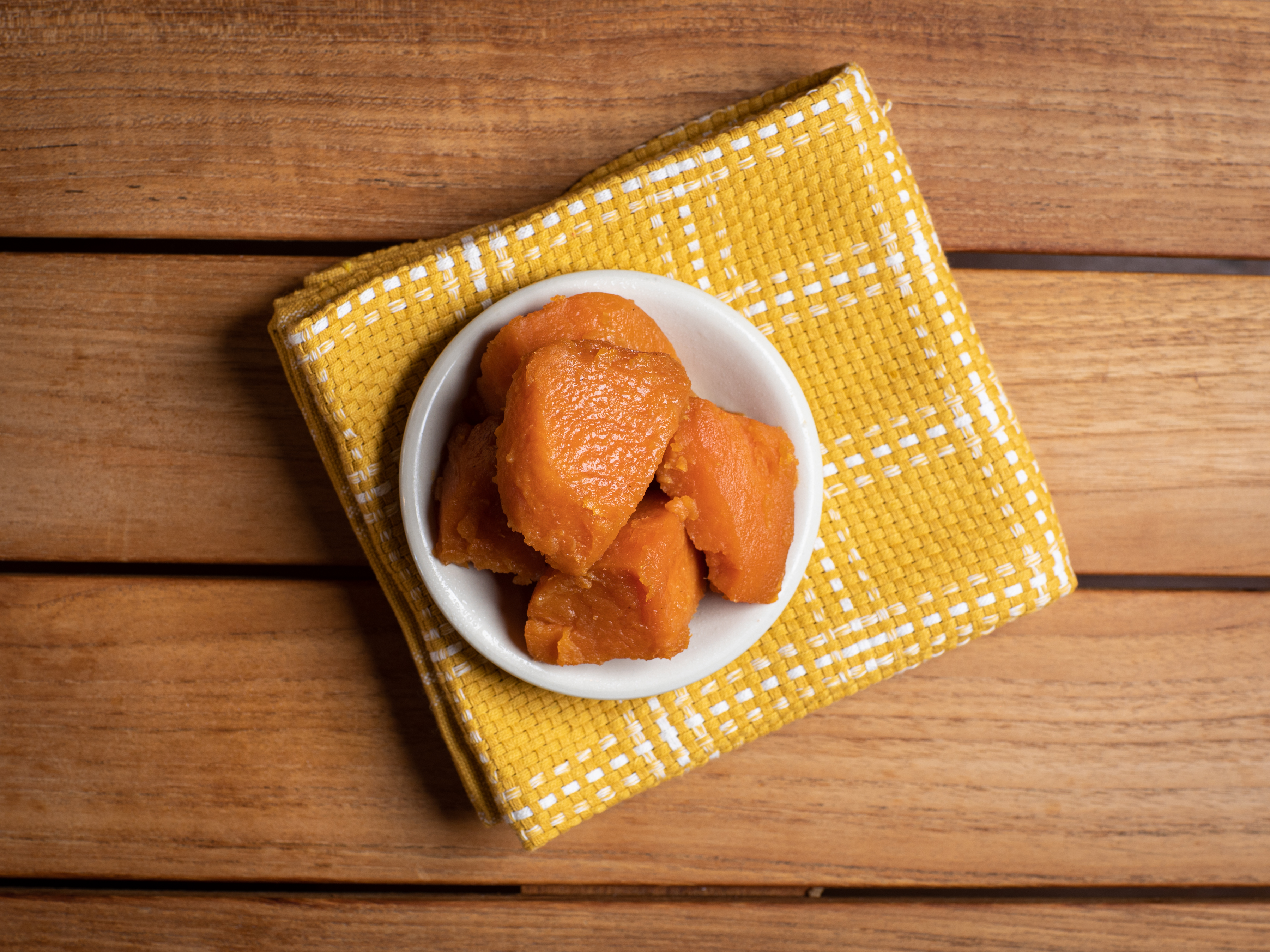 a plate of food sitting on top of a wooden table