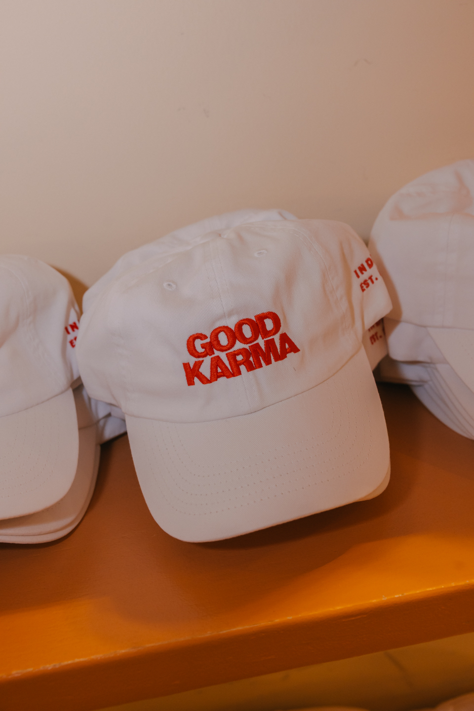 a group of white caps with red text