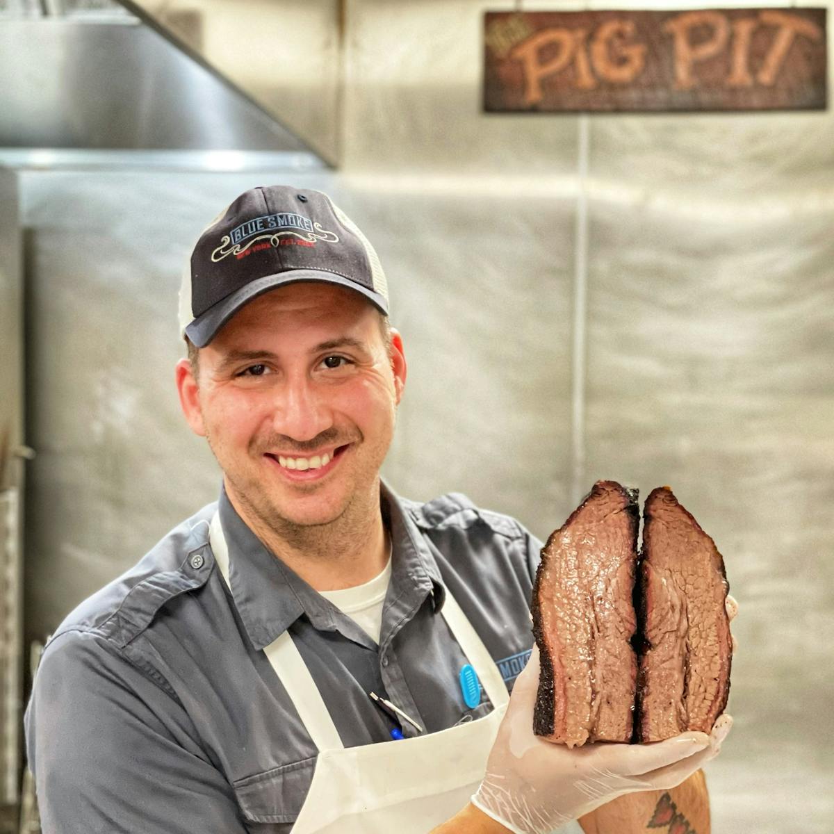 Executive Chef holding sliced beef