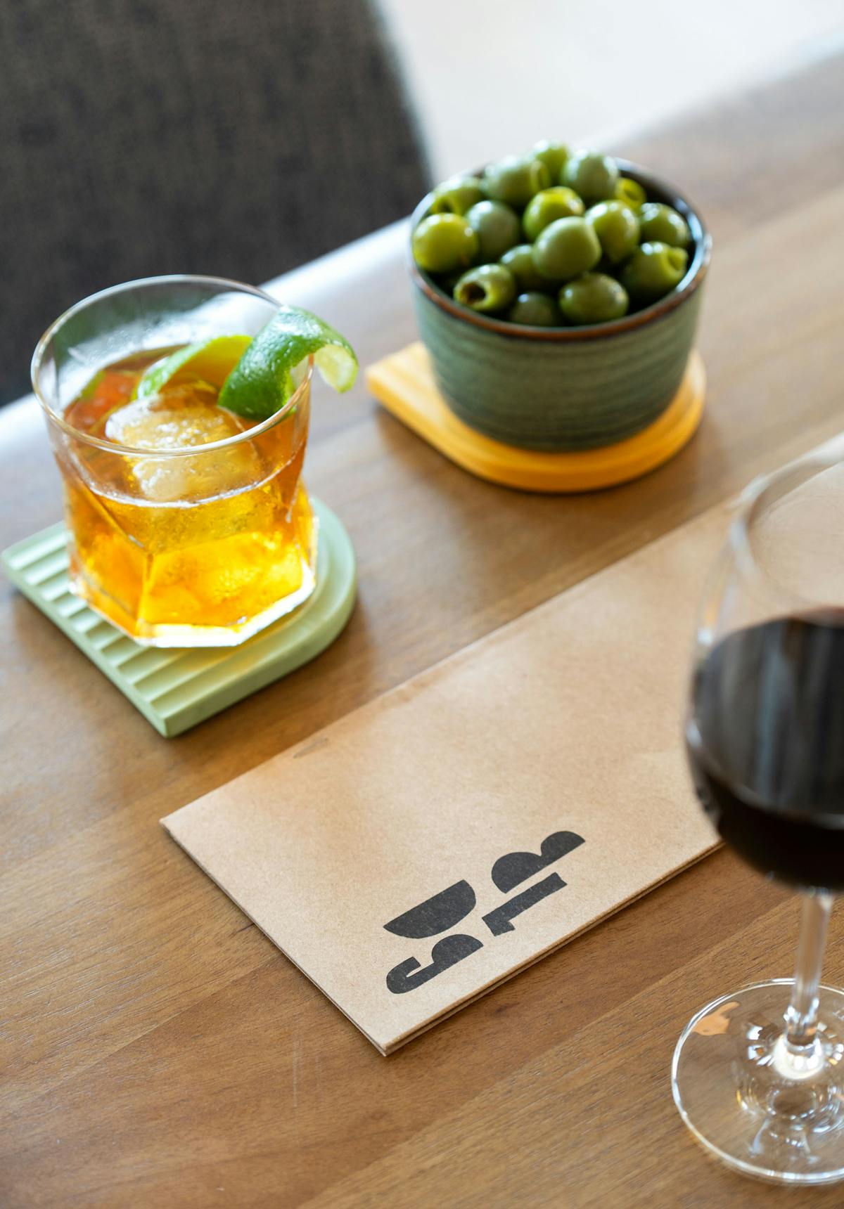 a cup of coffee sitting on top of a wooden table