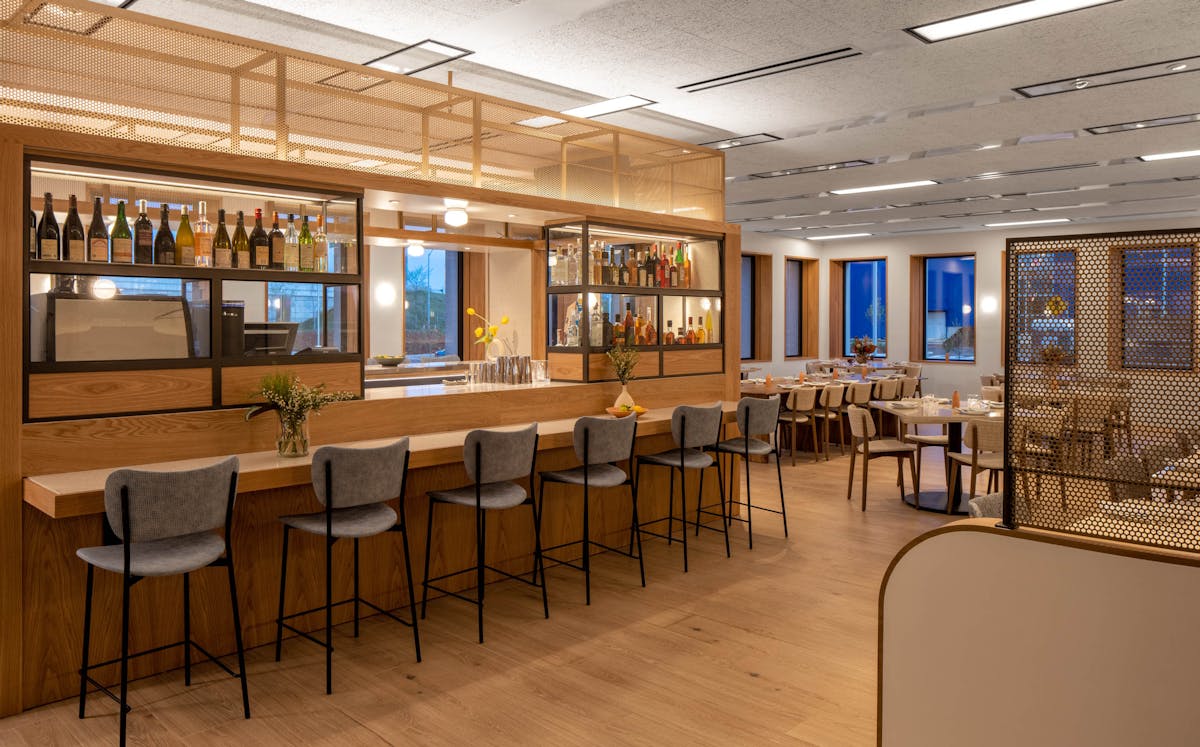 a room filled with furniture and a large window