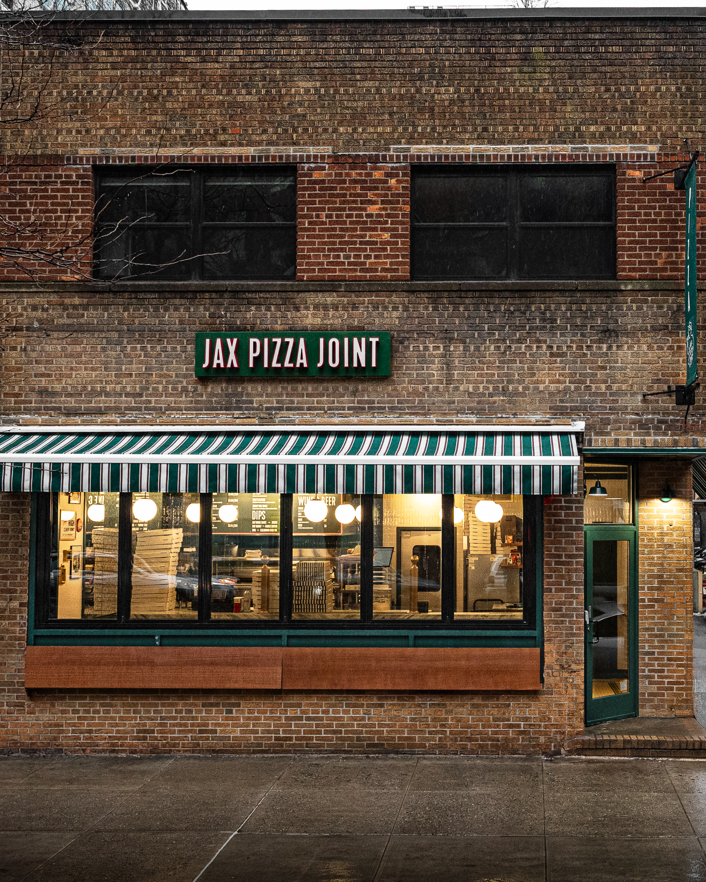 a brick building with a sign on the front