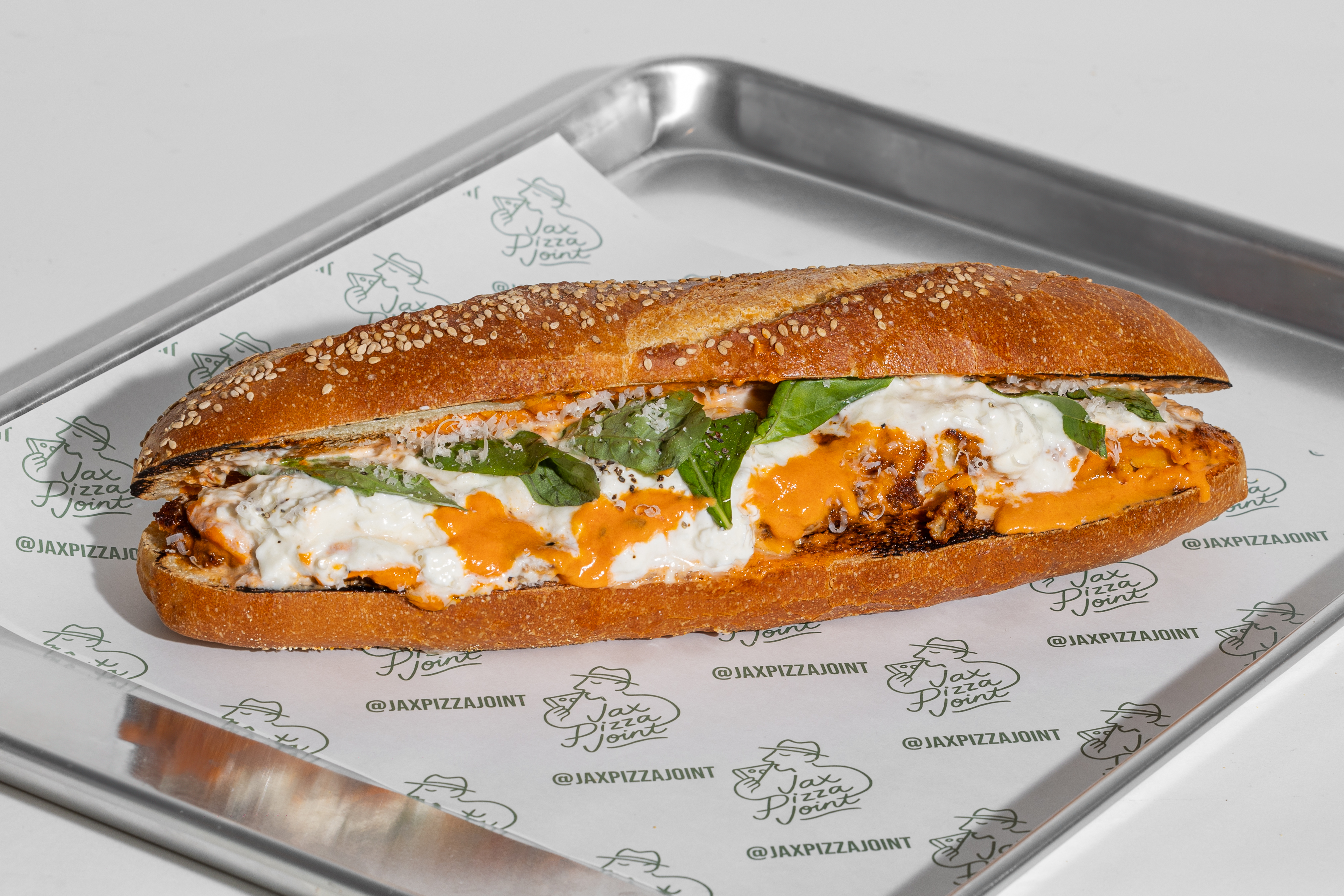 a pizza sitting on top of a wooden table