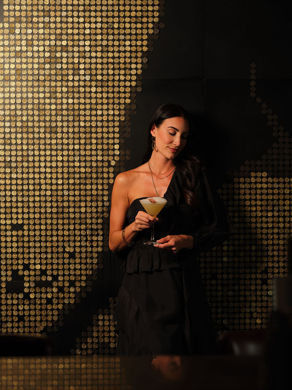a woman standing in front of a mirror posing for the camera