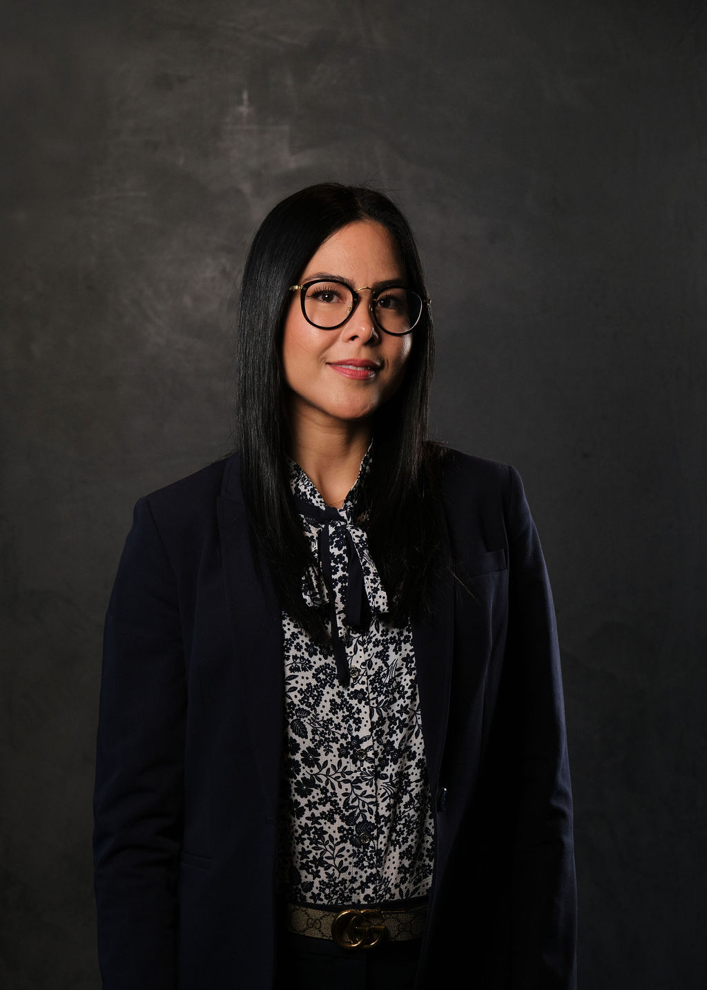 a woman standing in front of a camara