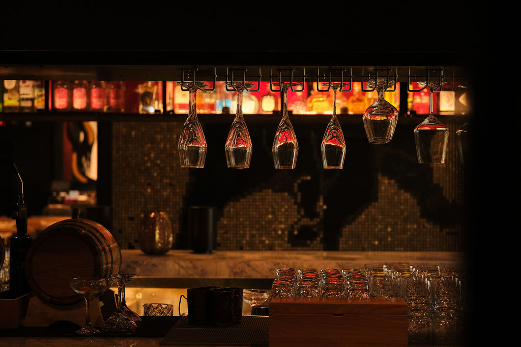 a group of men standing next to a fireplace