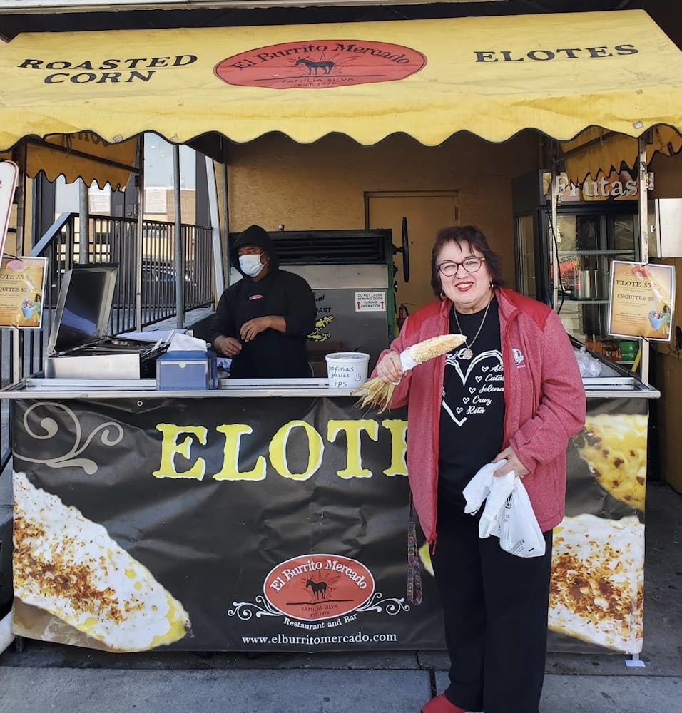 a group of people standing in front of a store