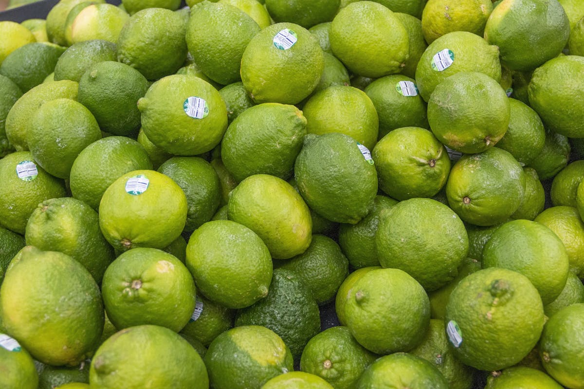 a pile of fruit sitting on top of a green apple