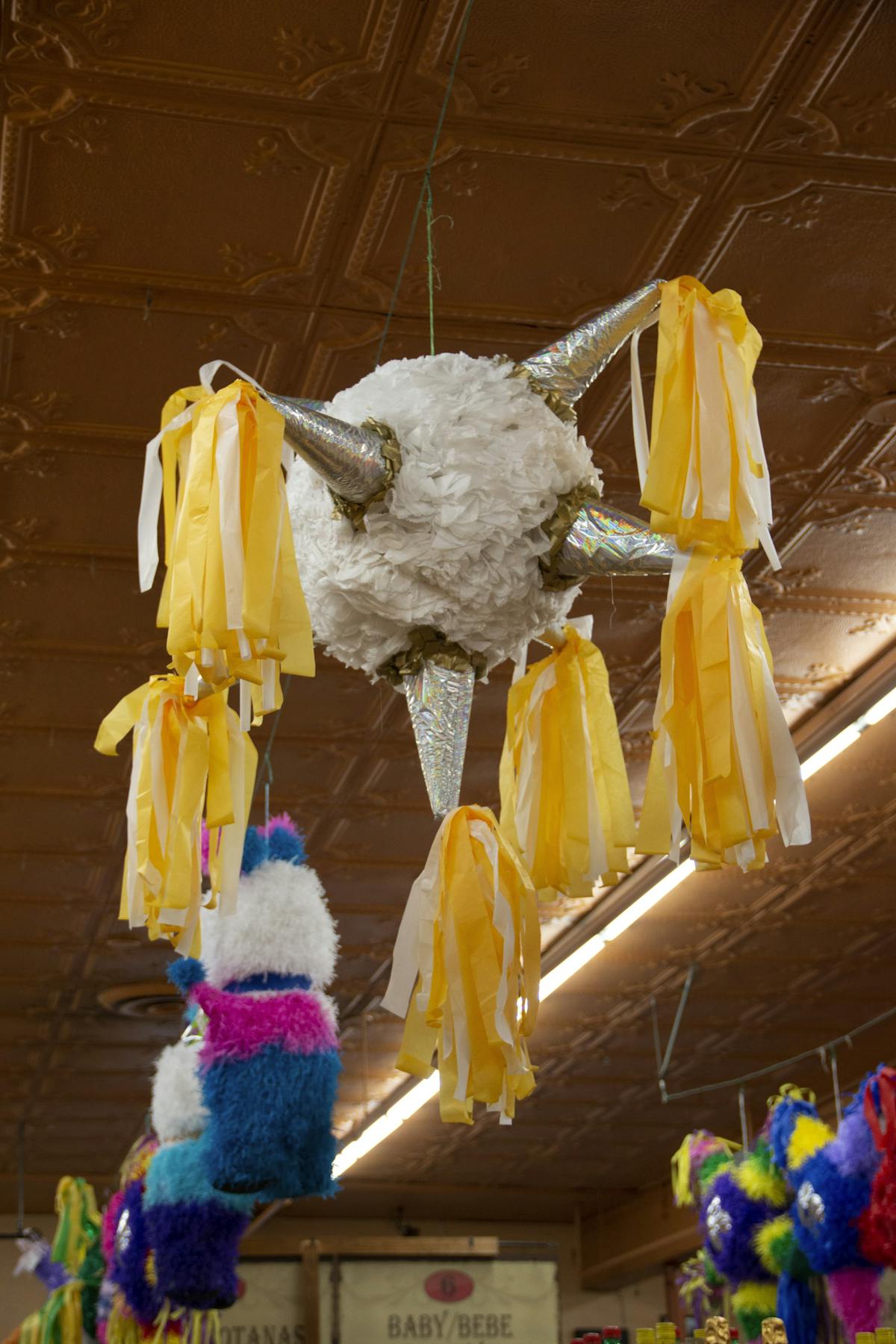 a group of stuffed animals hanging from the ceiling