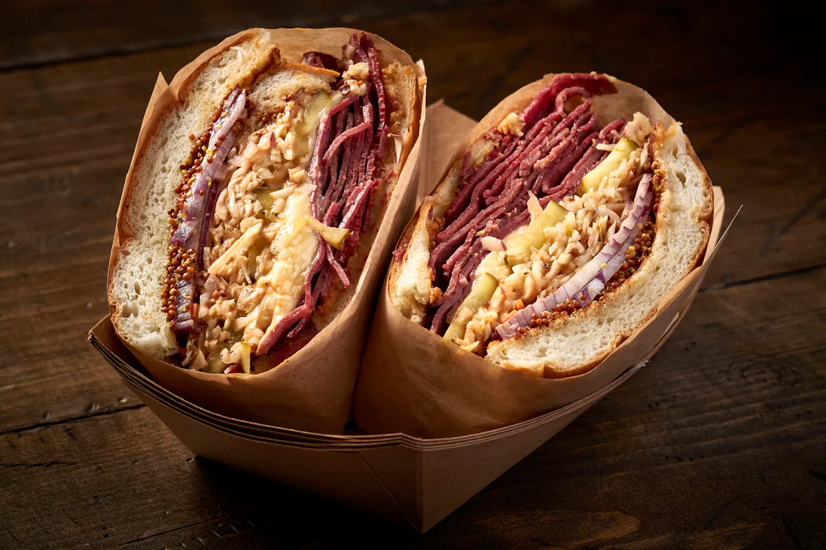 a cut in half sandwich sitting on top of a table