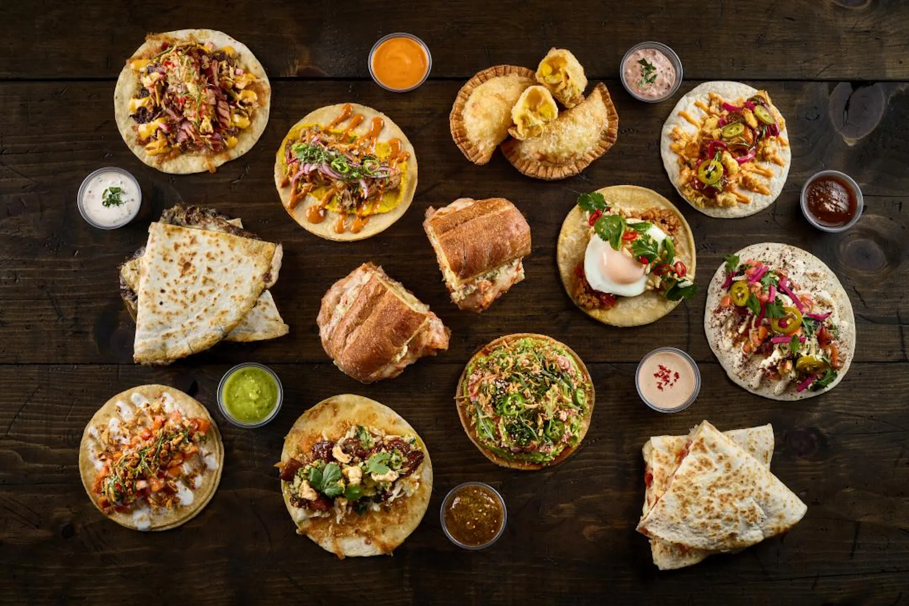 group shot of menu items available at Taco Bamba's Sterling location featuring Tortas, quesadillas, tacos, and more