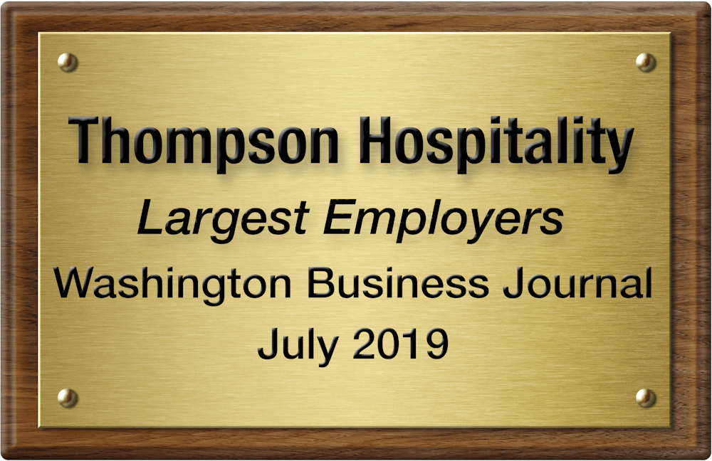 a sign on a wooden surface