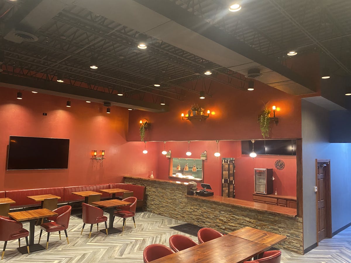 a room filled with furniture and a flat screen tv