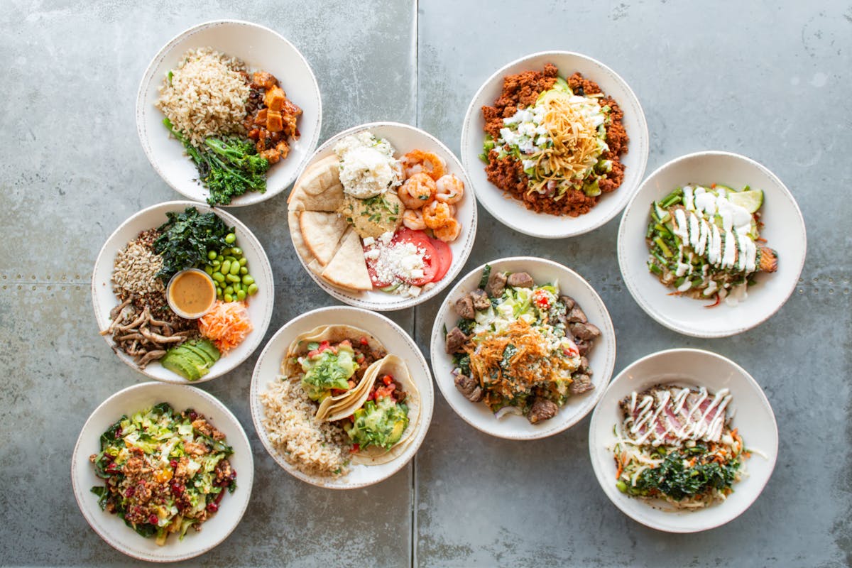 a bowl filled with different types of food on a table