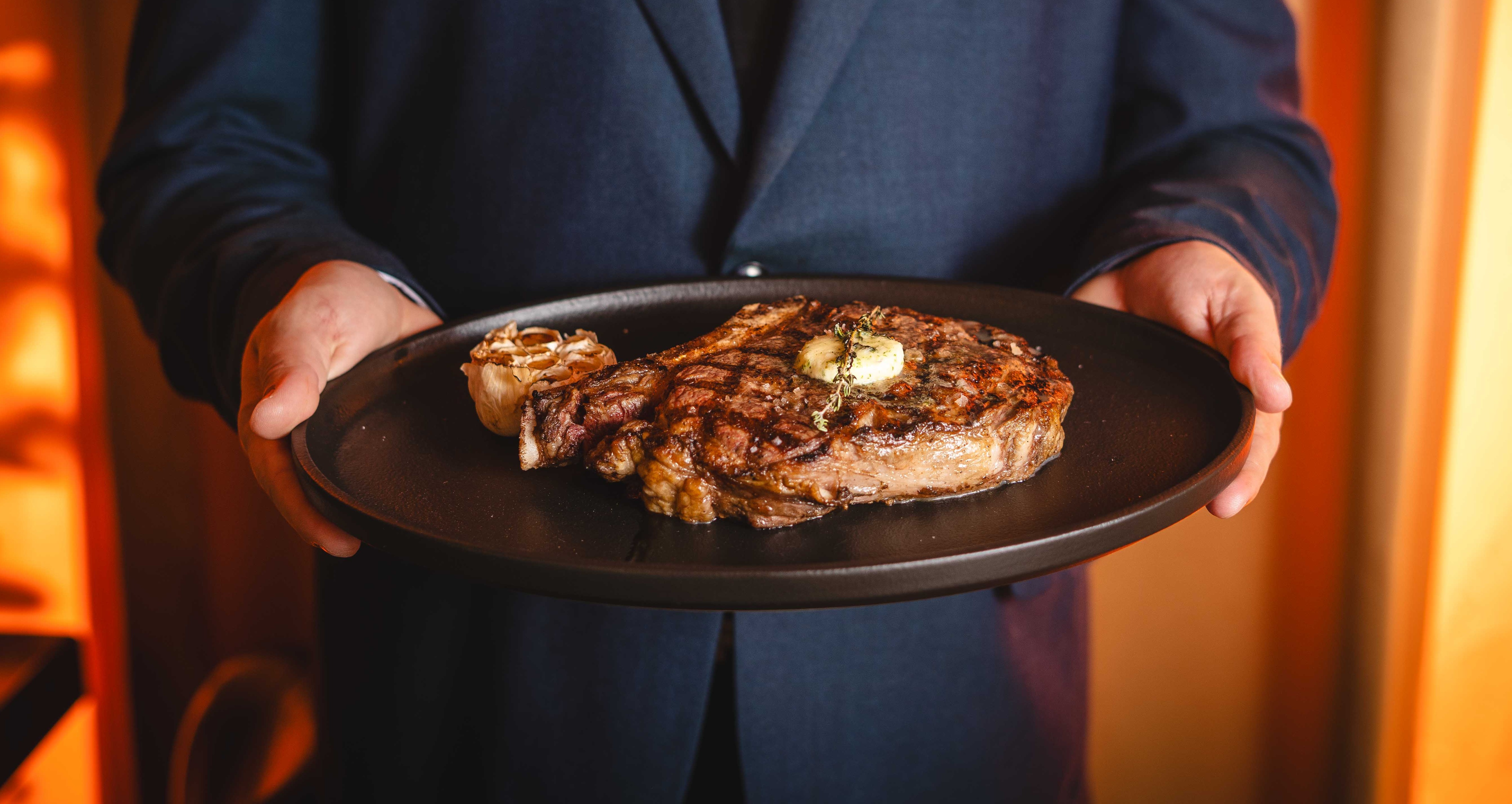a person cooking food in a pan