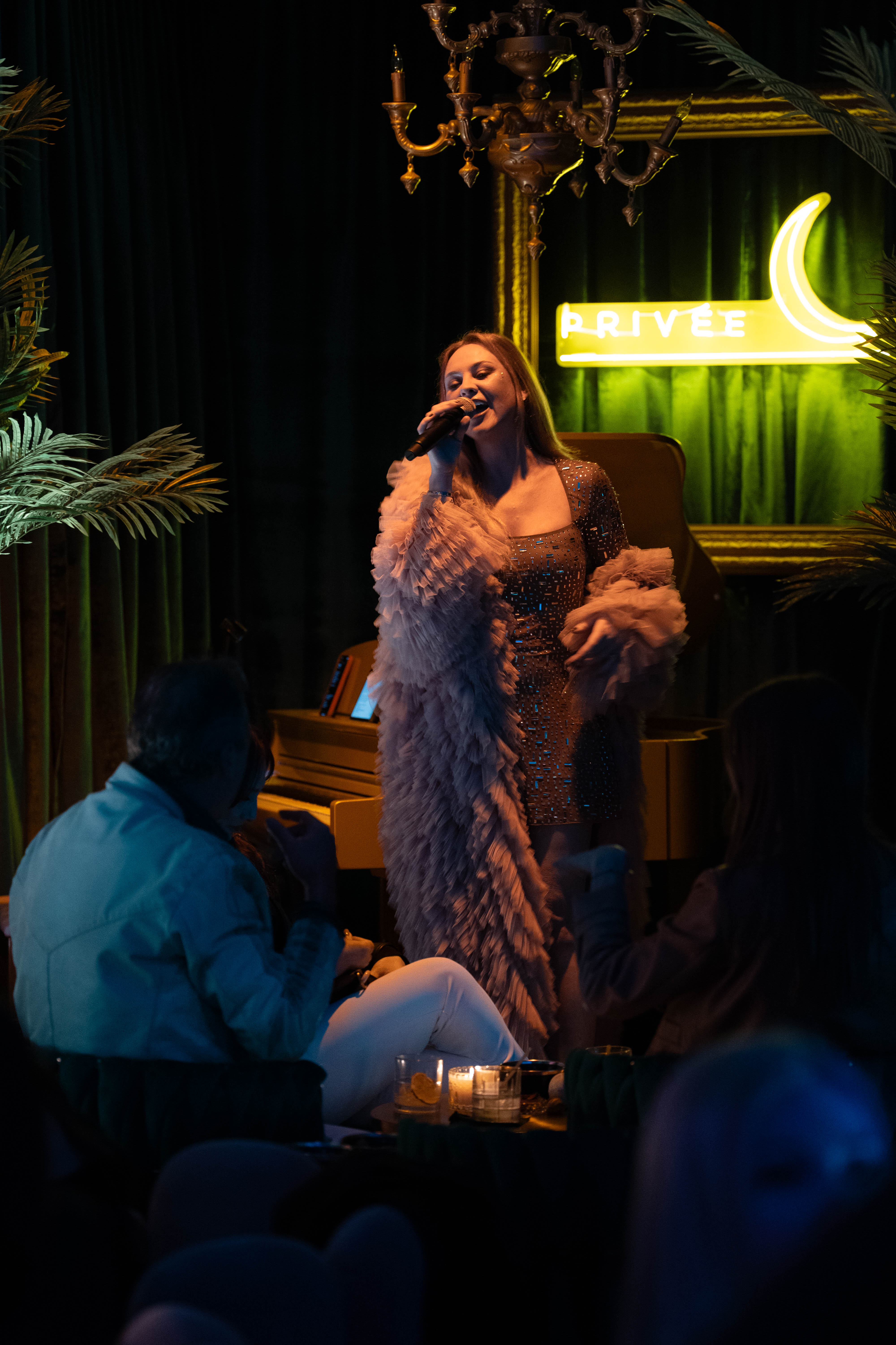 a person sitting in a dark room