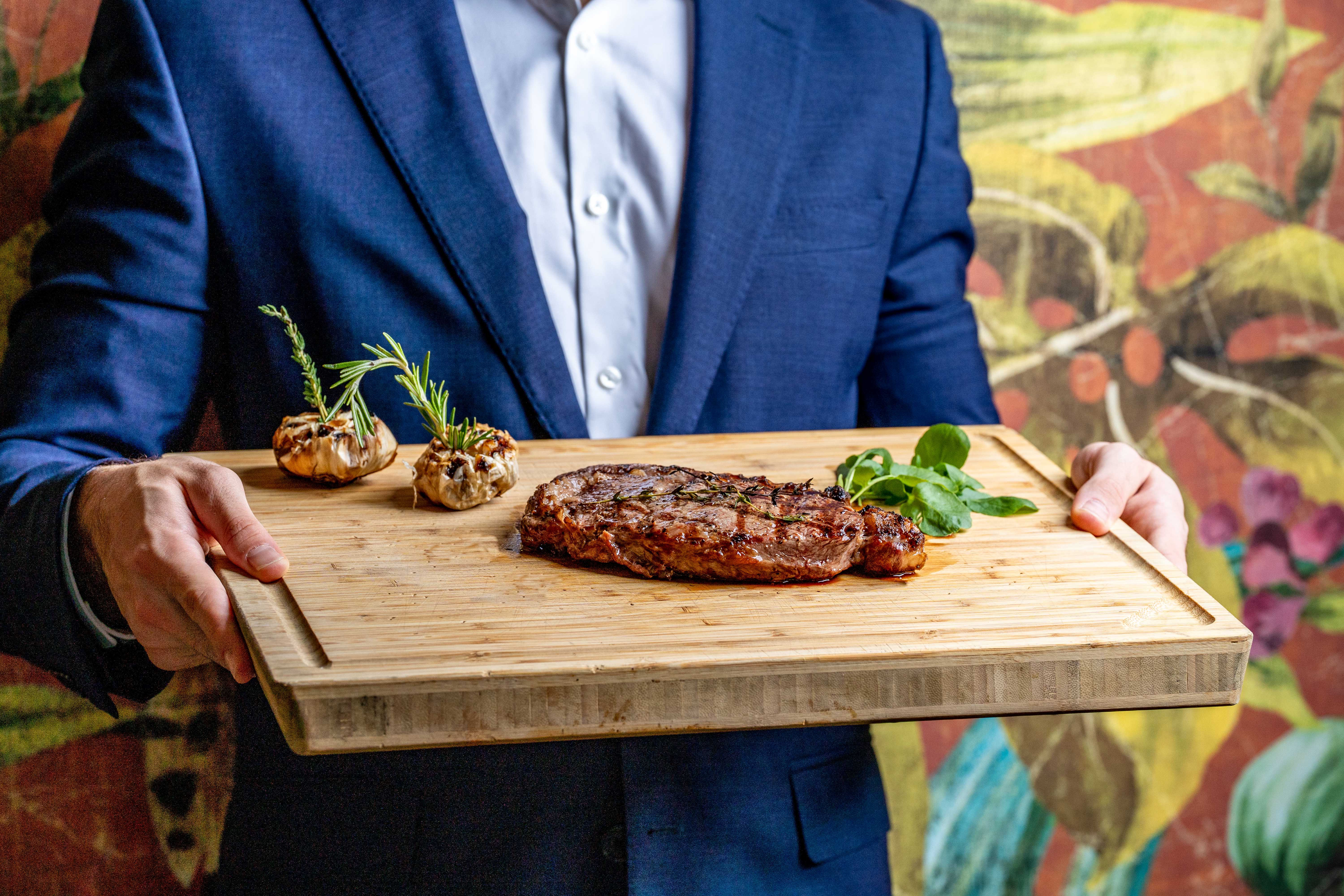 a man sitting at a table with food