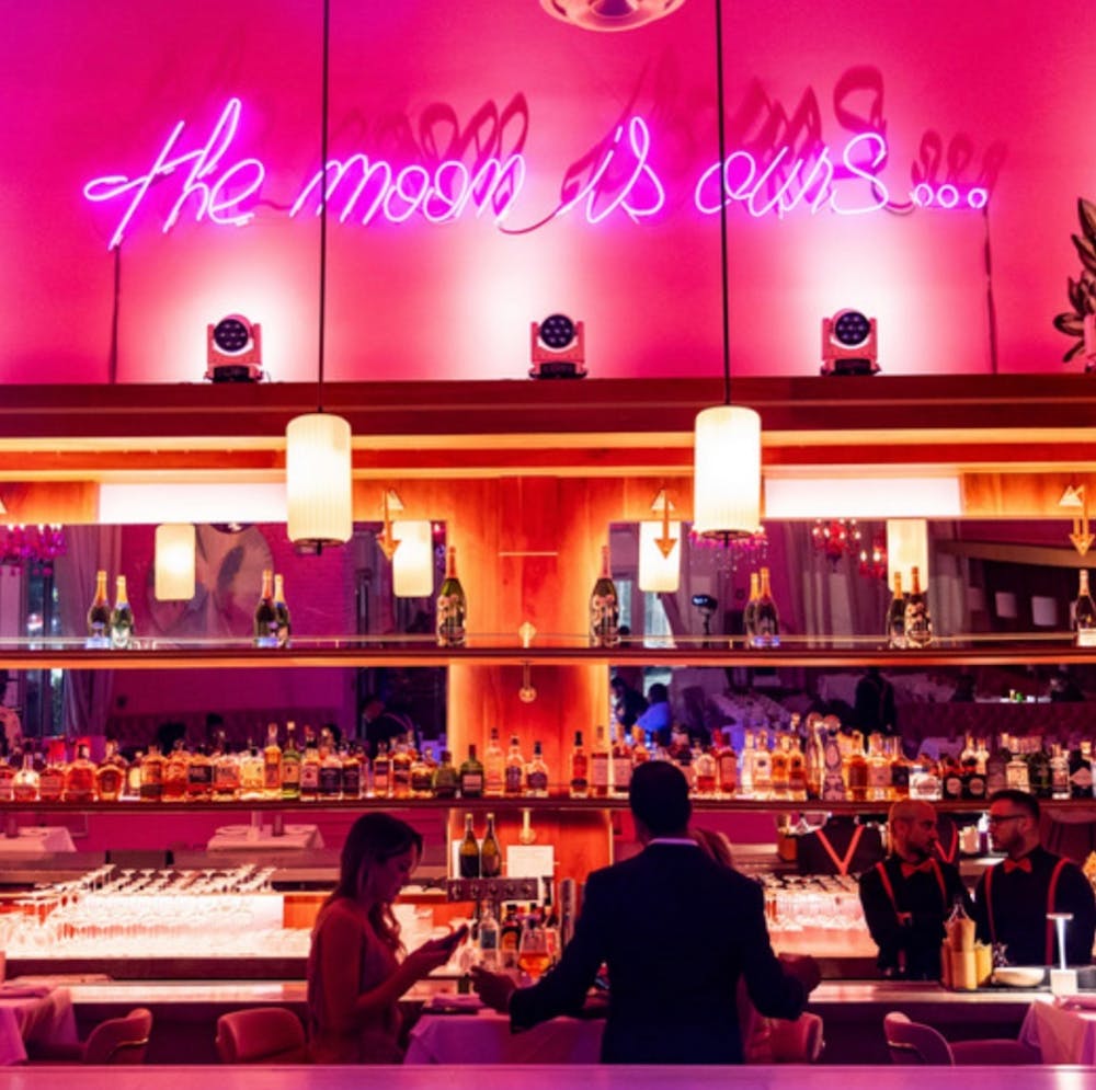 a room filled with pink flowers on a table