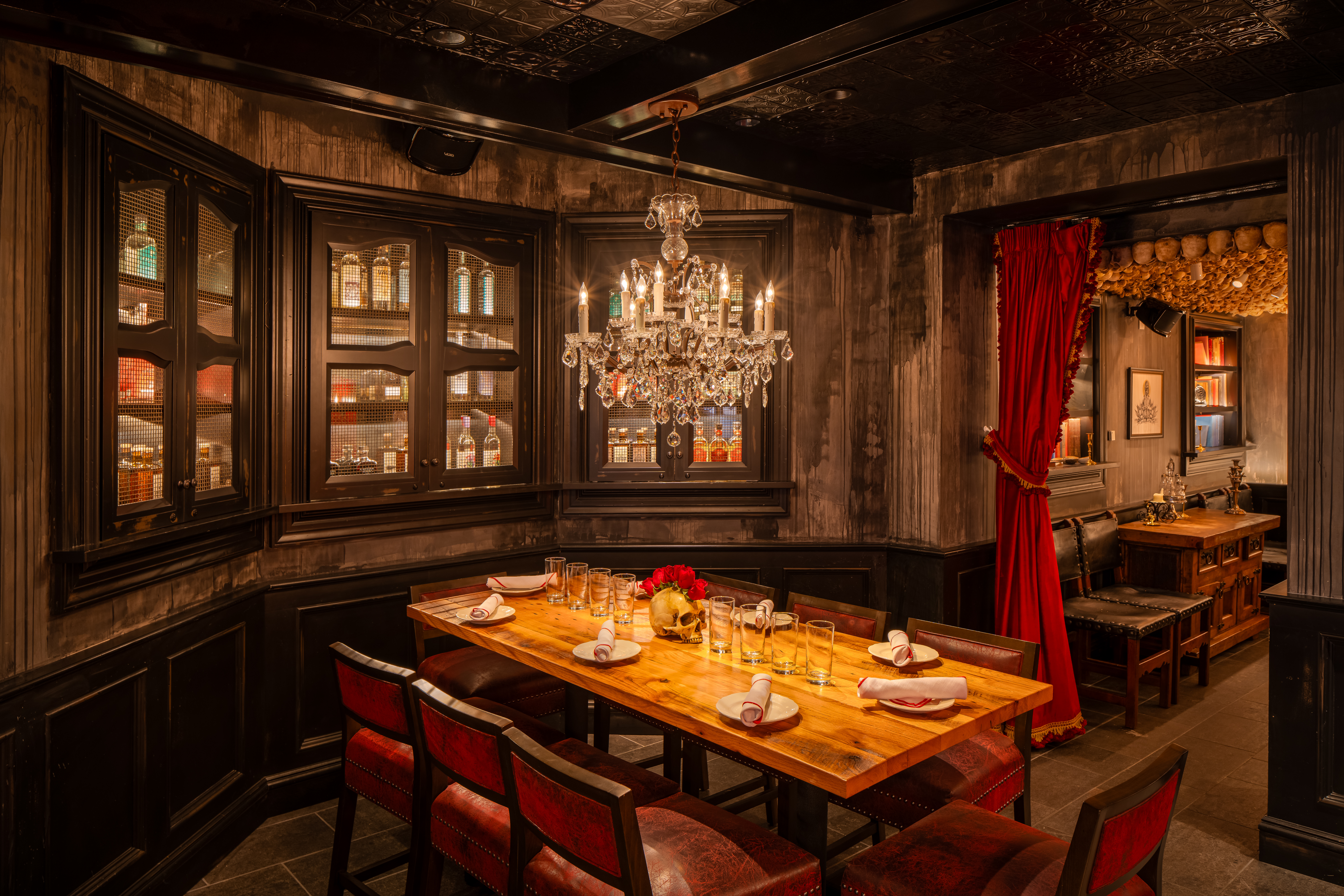 a table with chairs and a chandelier