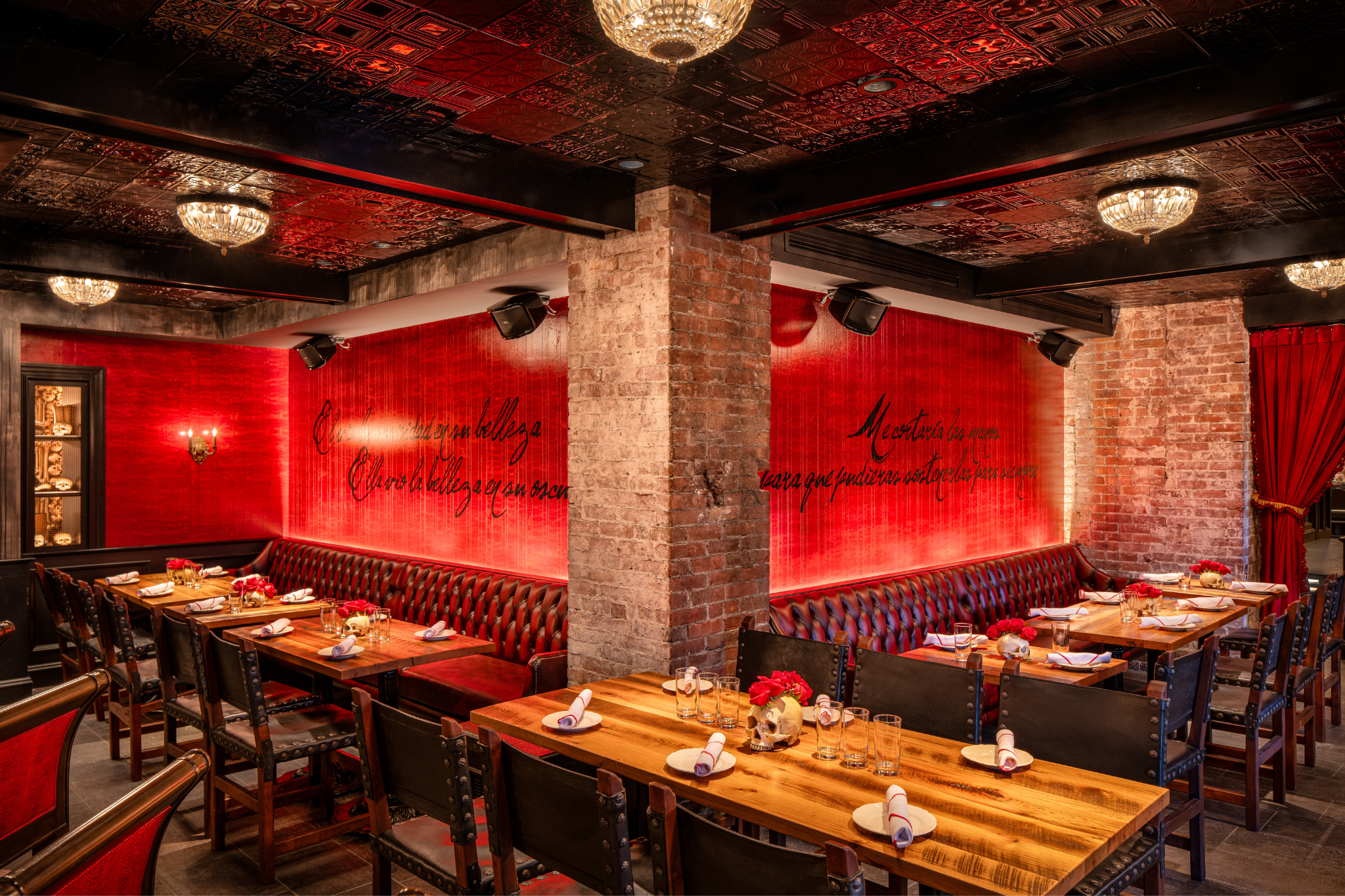 a restaurant with red walls and tables