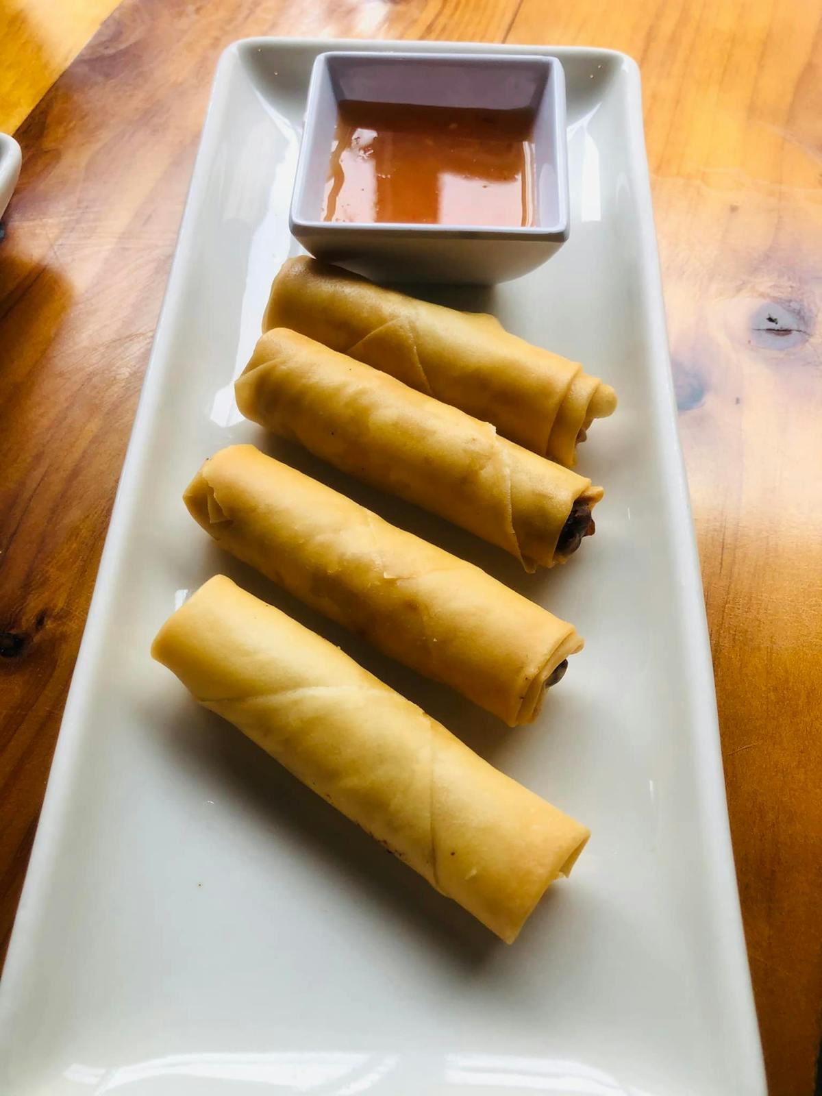 a tray of food on a wooden table