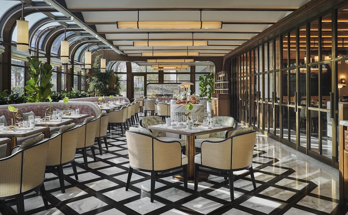 a room filled with furniture and a metal fence