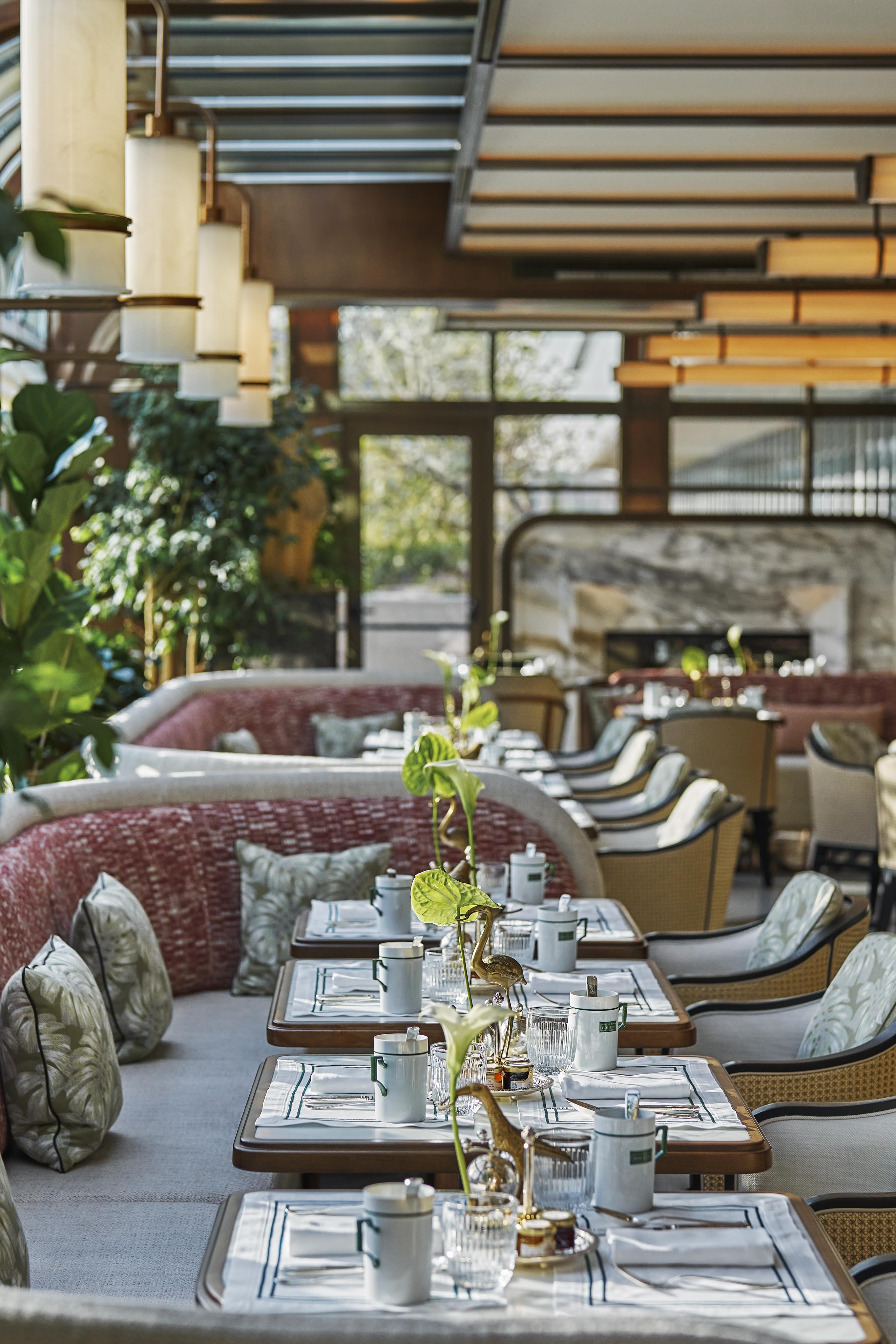 a room filled with furniture and vase on a table