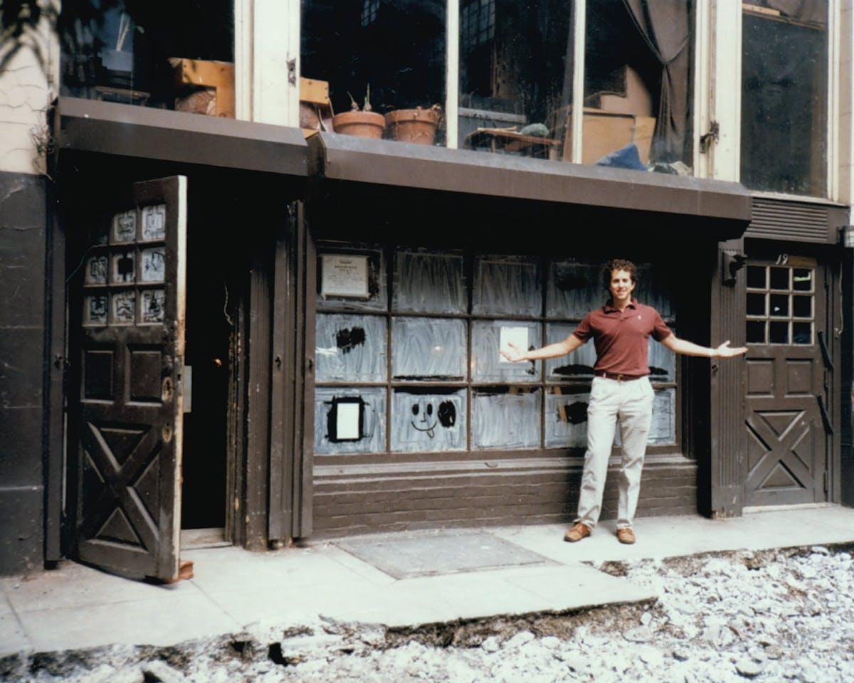 a man standing in front of a building