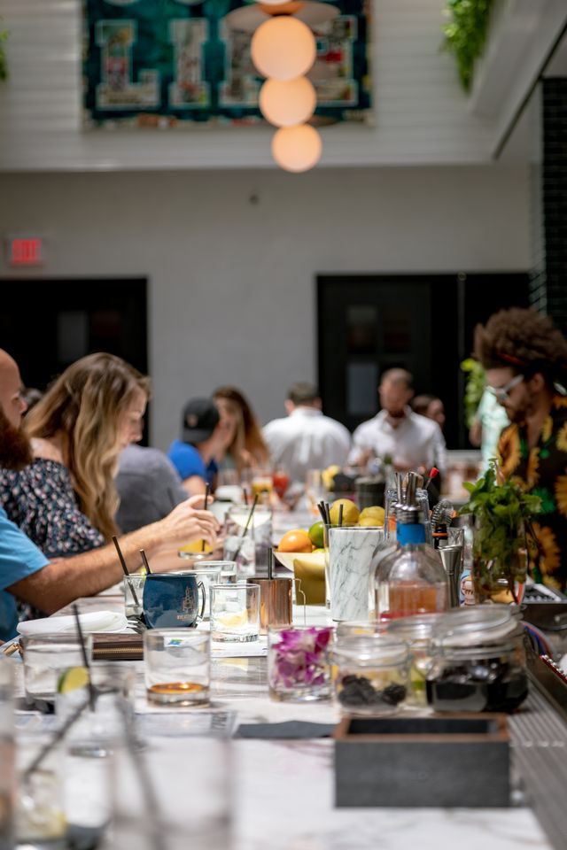 a group of people sitting at a table in a restaurant