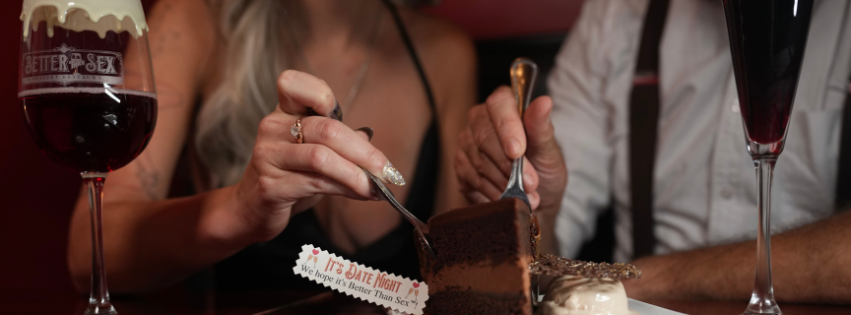 Close up of a chocolate cake being shared by a couple in a romantic setting at Better Than Sex A  Dessert Restaurant