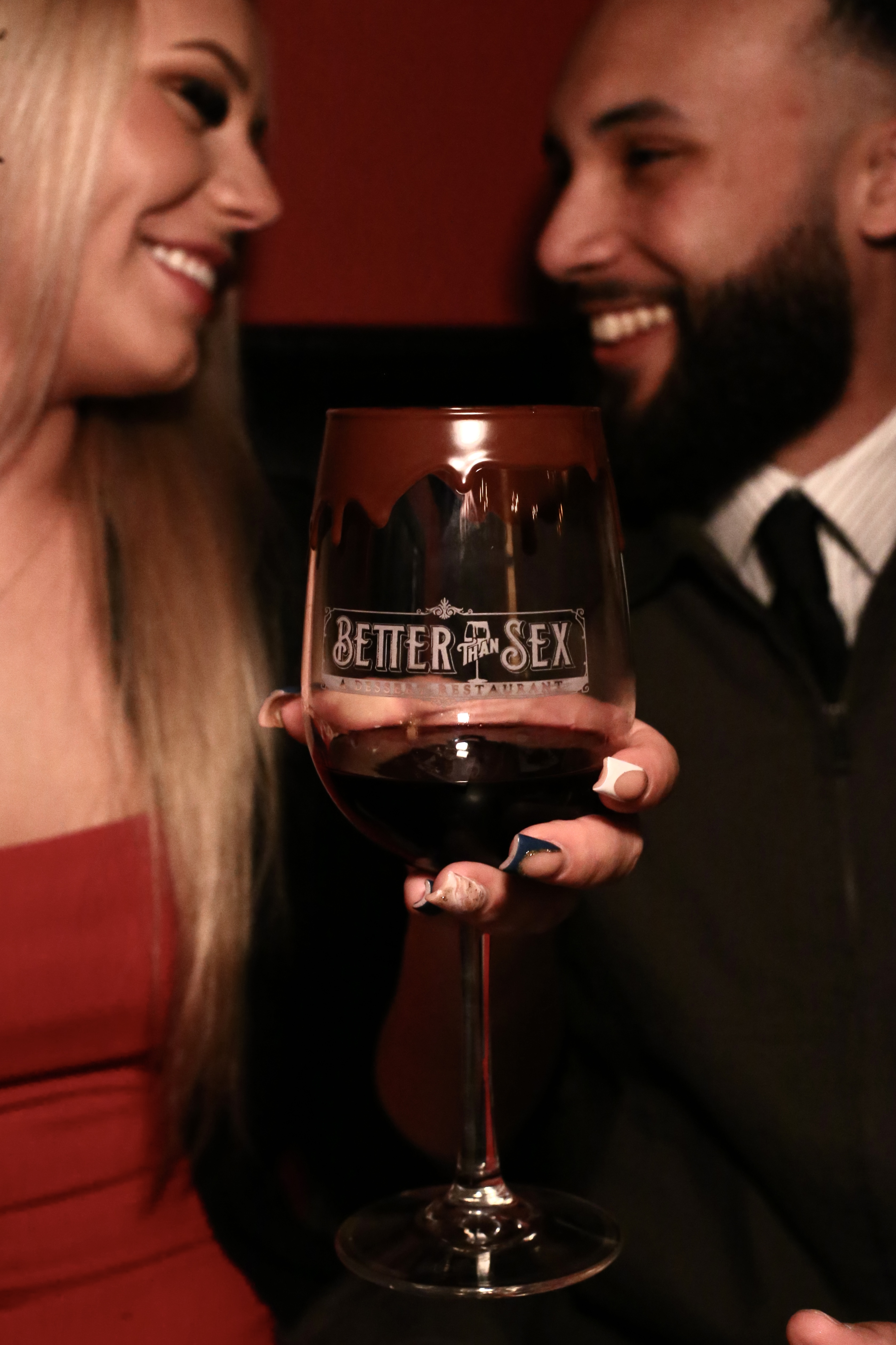 Couple enjoying a romantic dessert date night at Better Than Sex