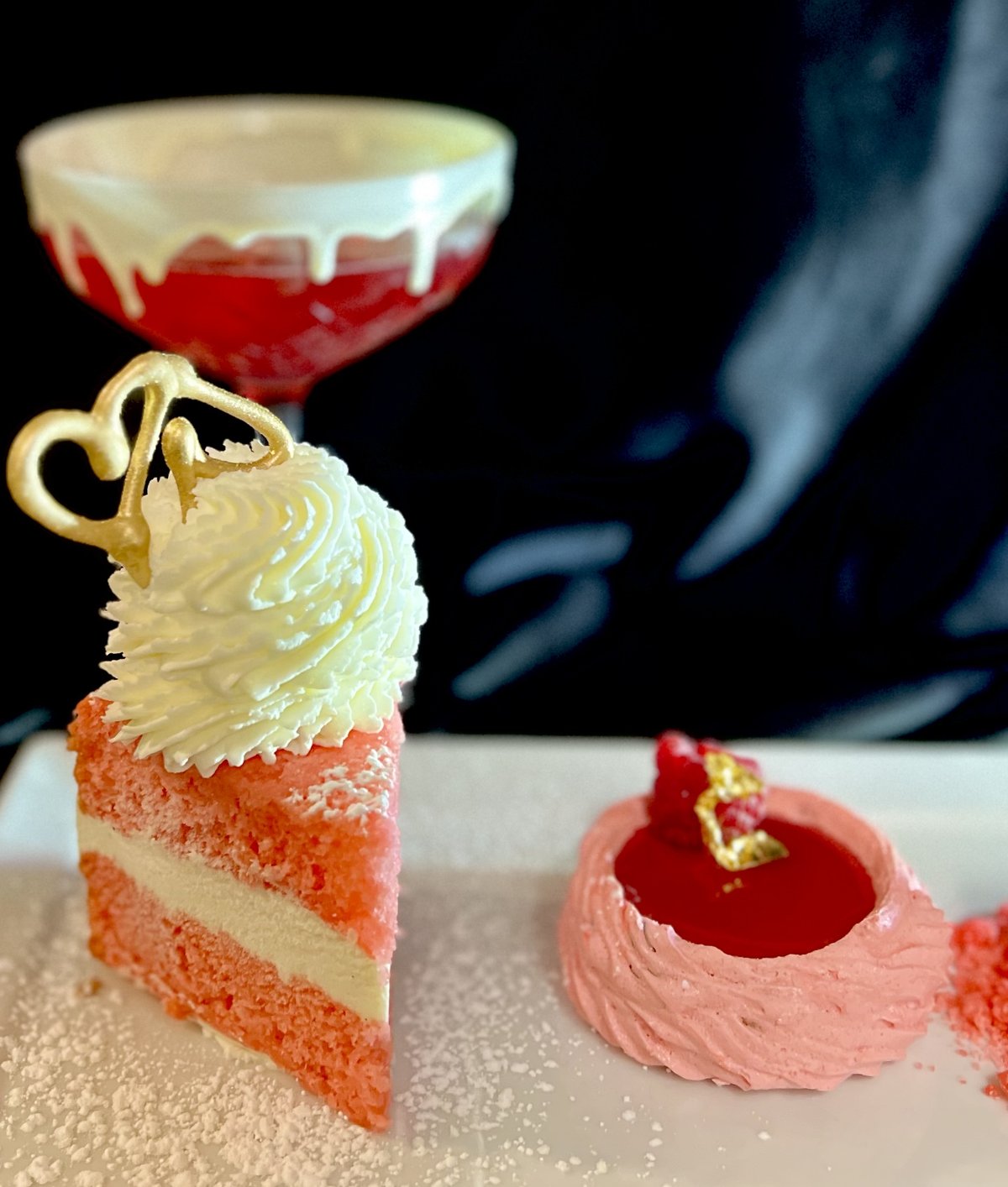 a slice of cake with a glass of liquid