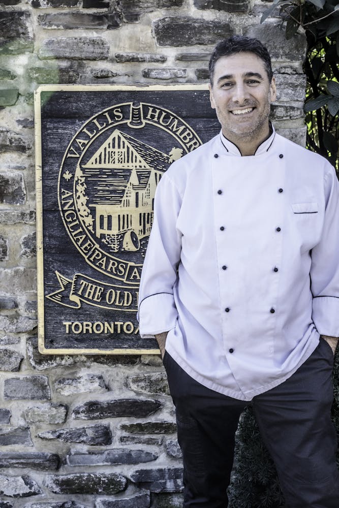 a man standing in front of a building