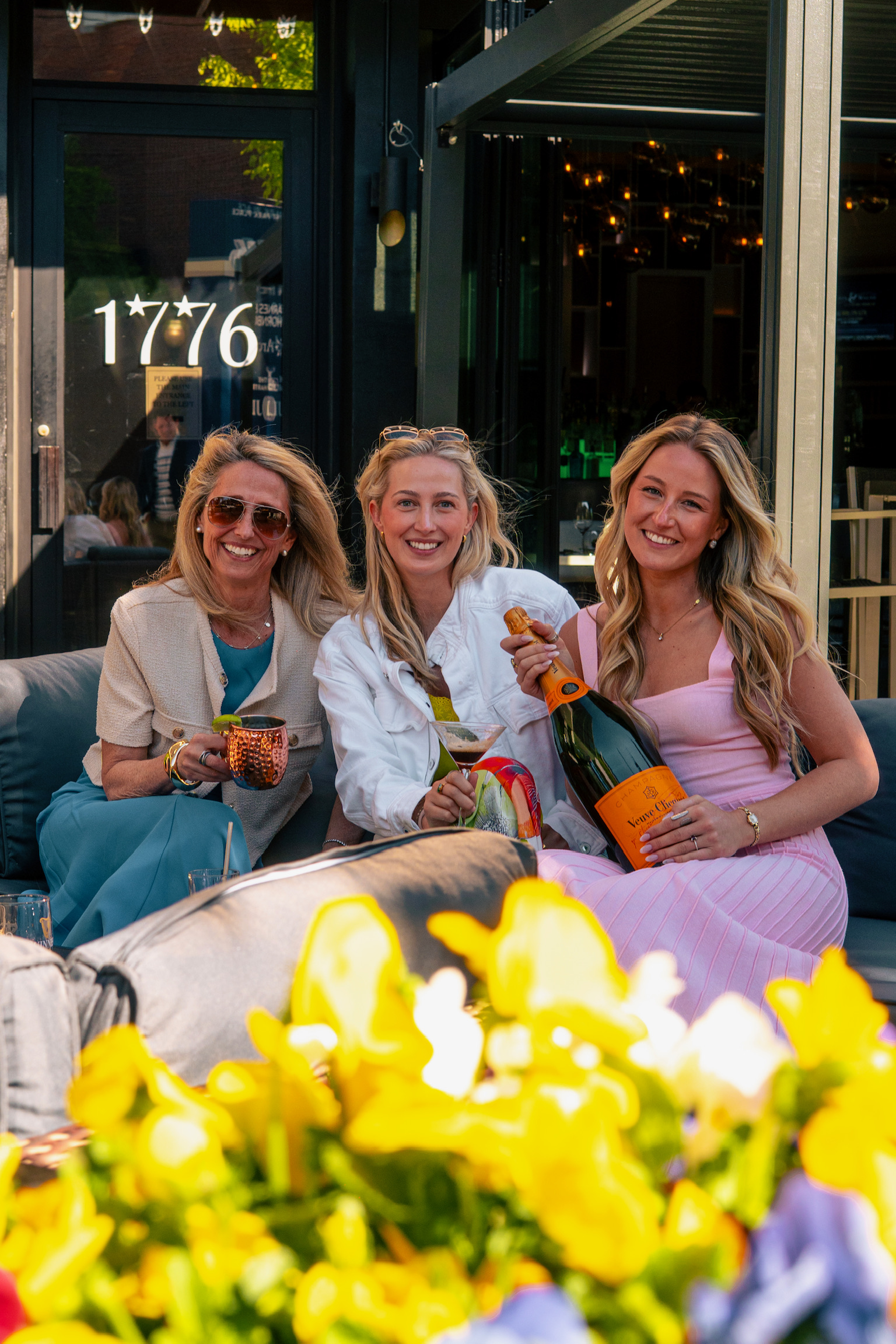 a group of women sitting on a couch